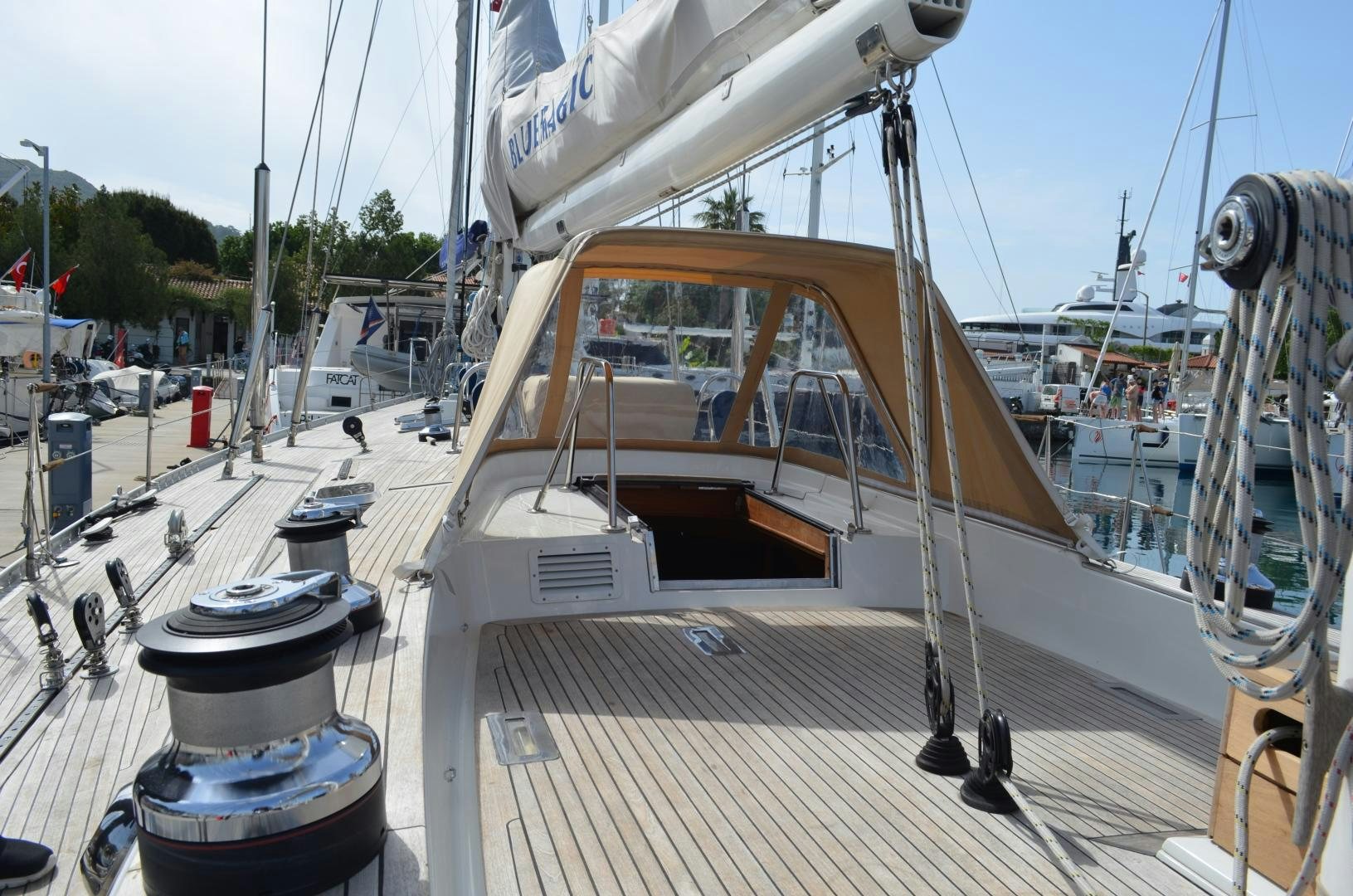 a boat on a deck aboard blue magic Yacht for Sale