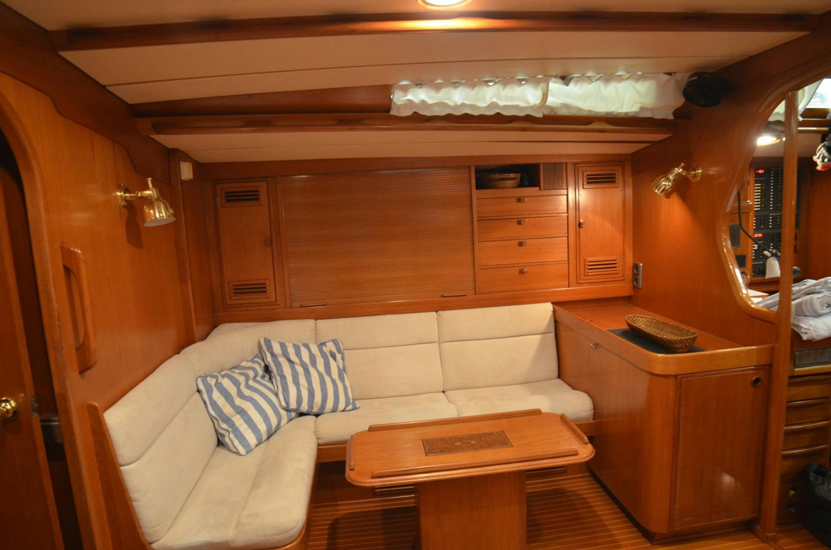 a room with a bed and a desk aboard blue magic Yacht for Sale
