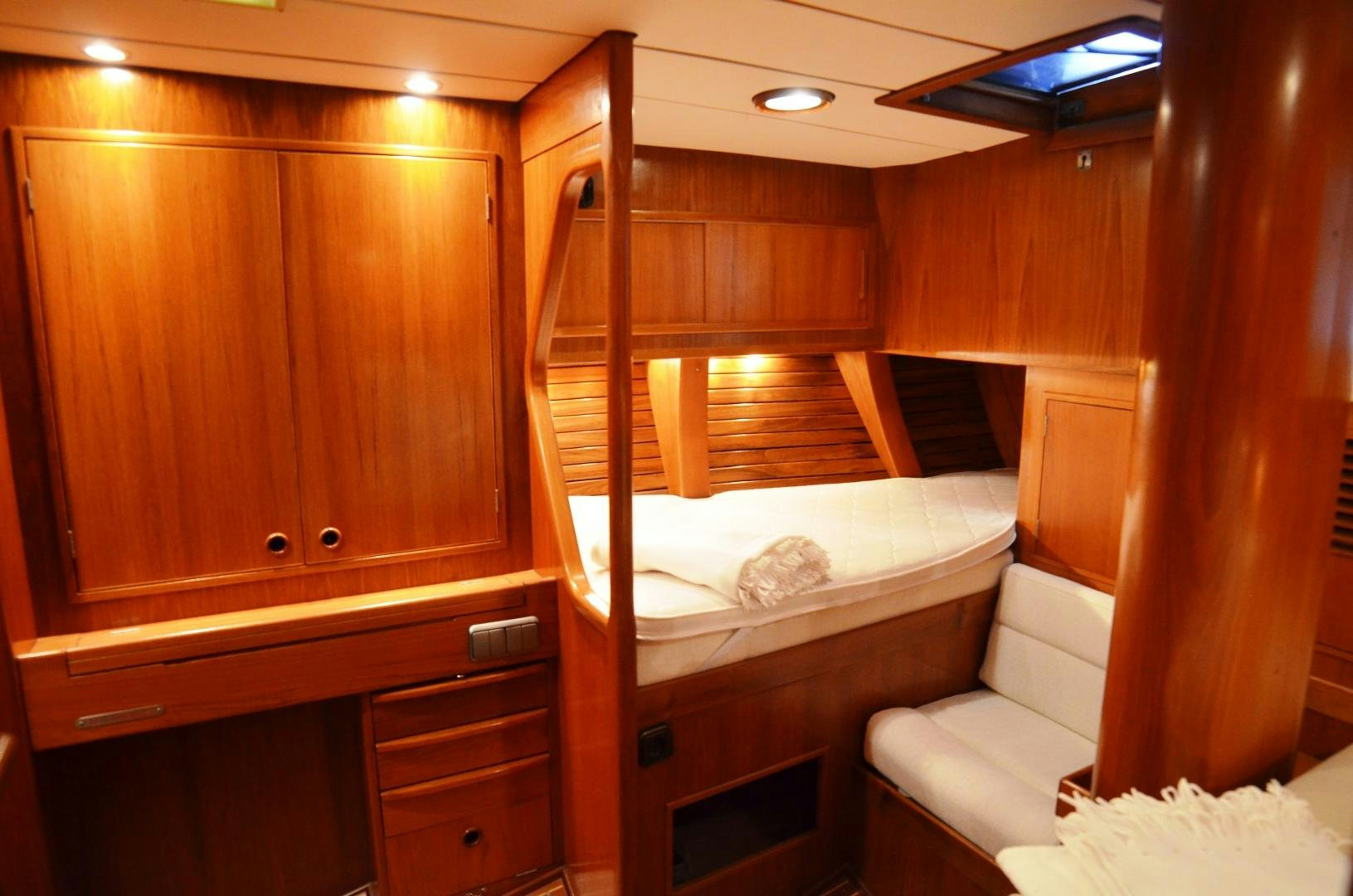 a room with bunk beds aboard blue magic Yacht for Sale