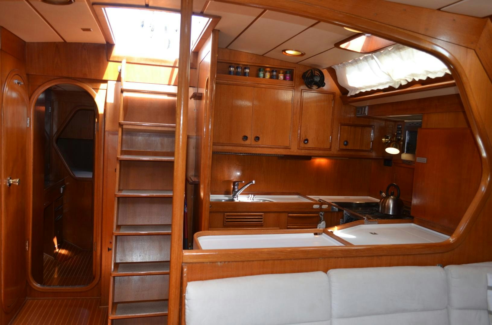 a bathroom with wooden cabinets aboard blue magic Yacht for Sale