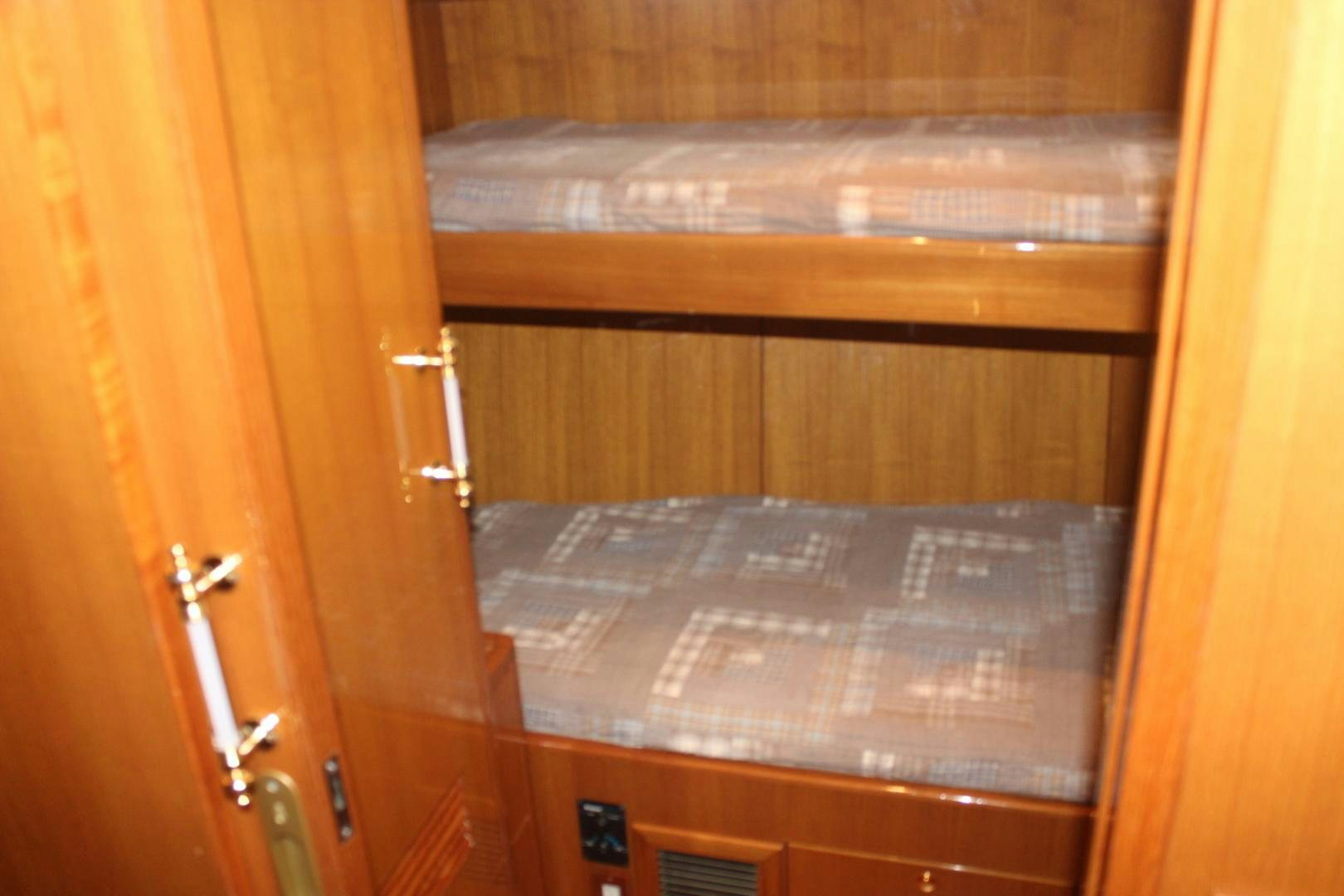 a wooden cabinet with a door aboard LADY CYNTHIA Yacht for Sale