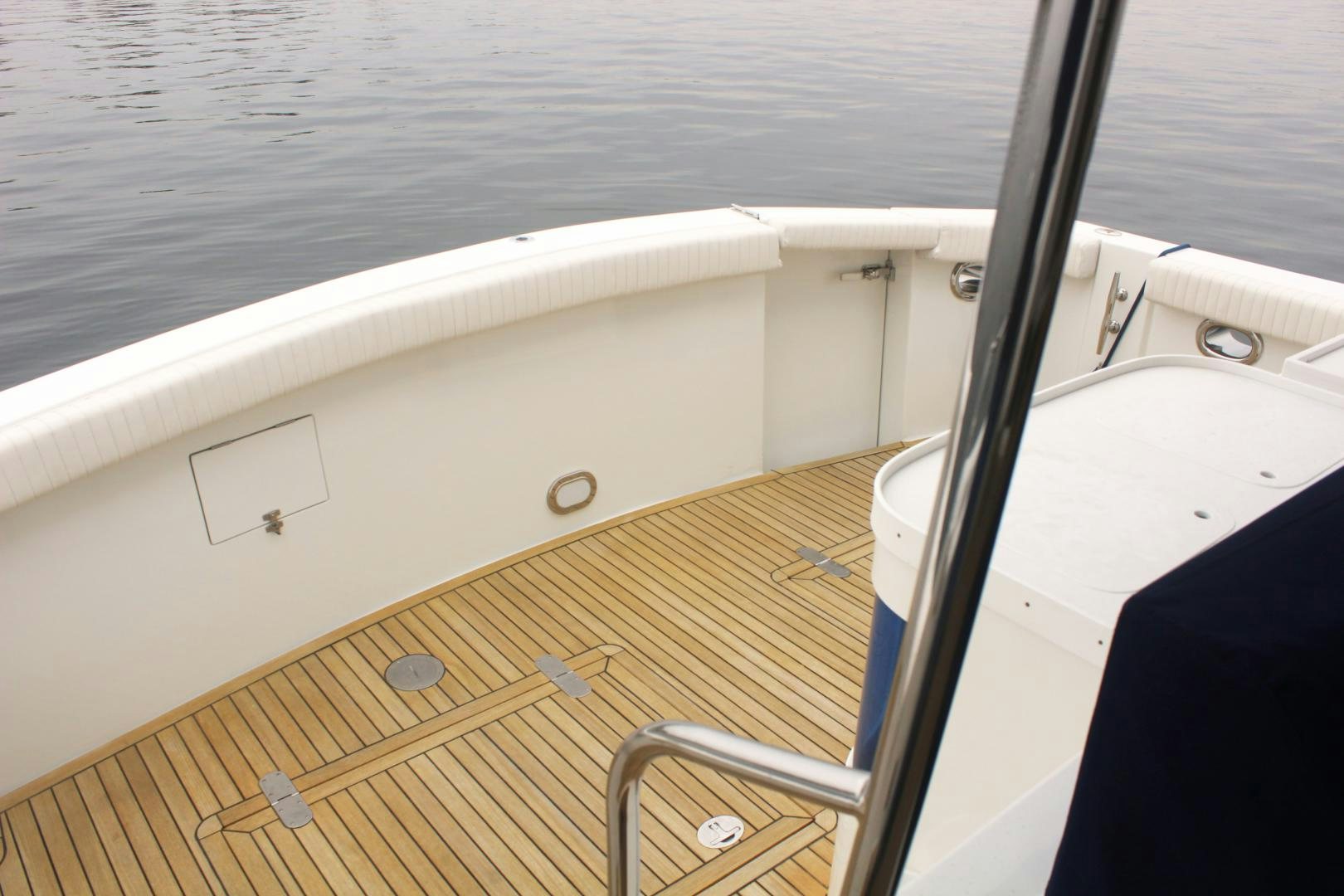 a boat with a wooden deck aboard LADY CYNTHIA Yacht for Sale