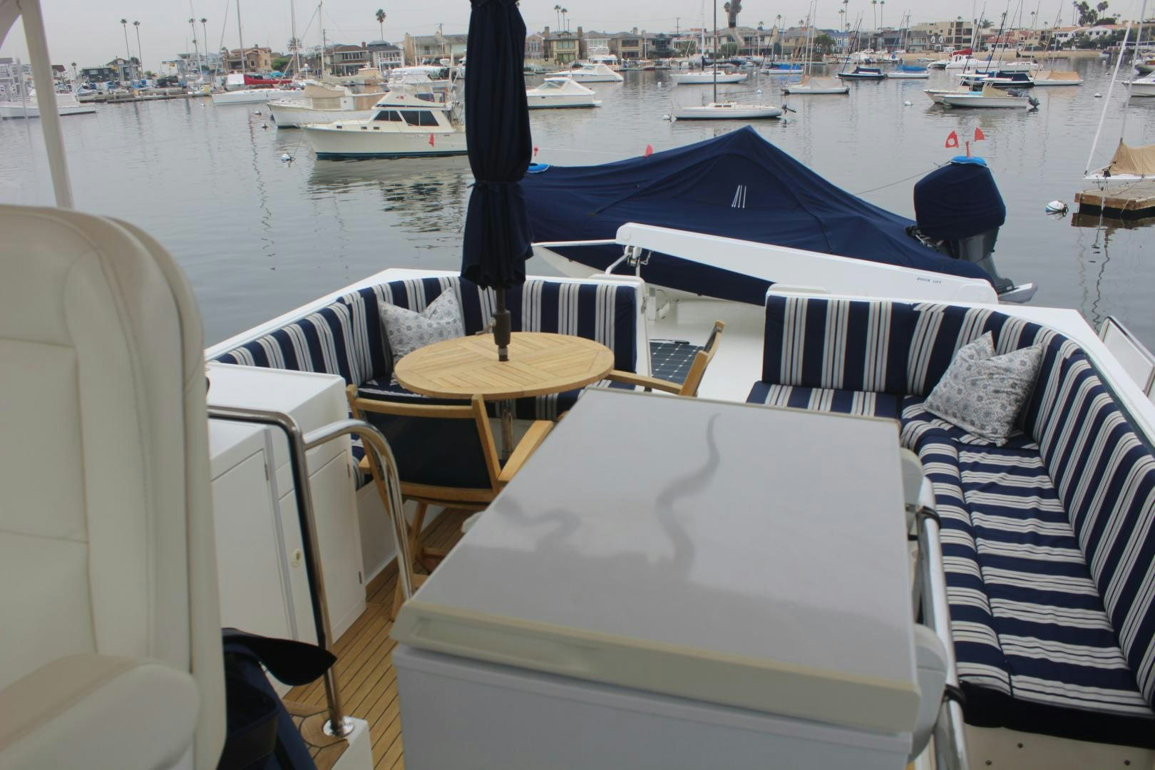 a boat with a table and chairs aboard LADY CYNTHIA Yacht for Sale