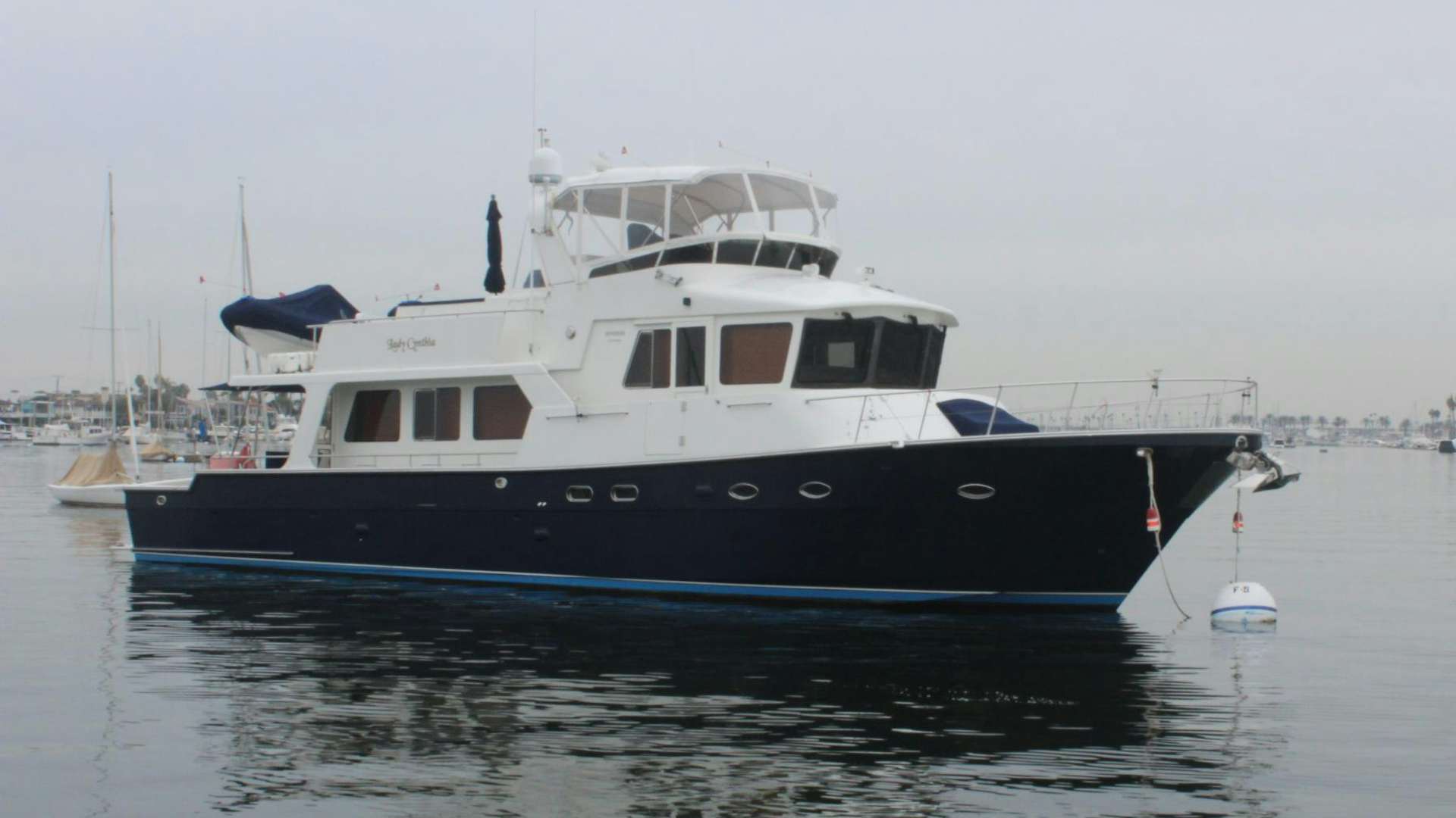 a large boat in the water aboard LADY CYNTHIA Yacht for Sale