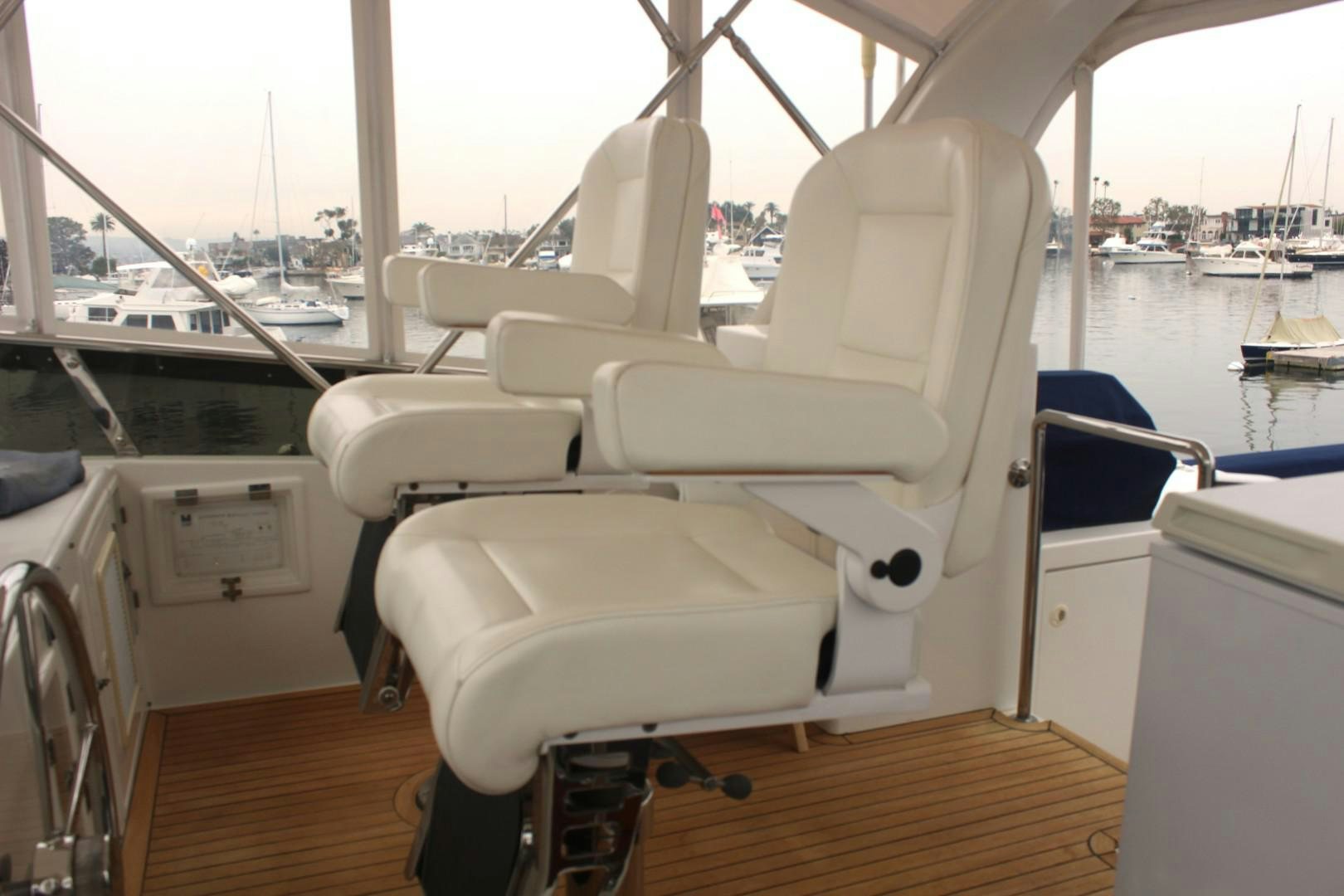 a boat with white seats aboard LADY CYNTHIA Yacht for Sale