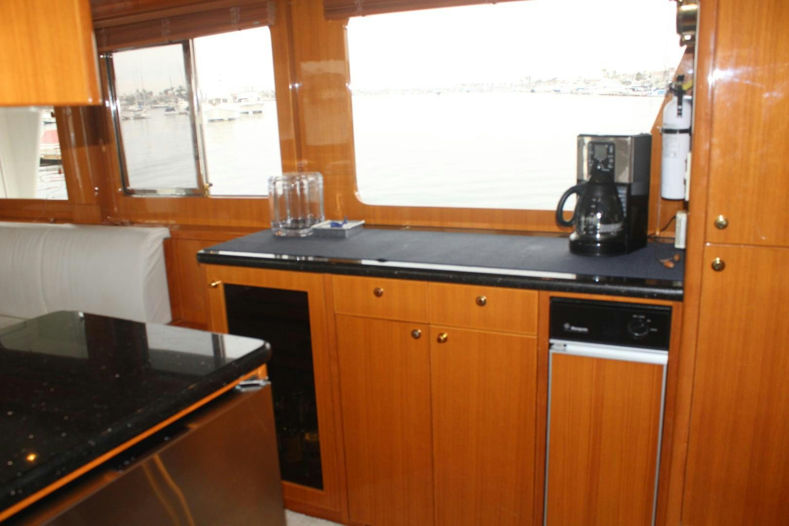 a kitchen with a coffee maker aboard LADY CYNTHIA Yacht for Sale