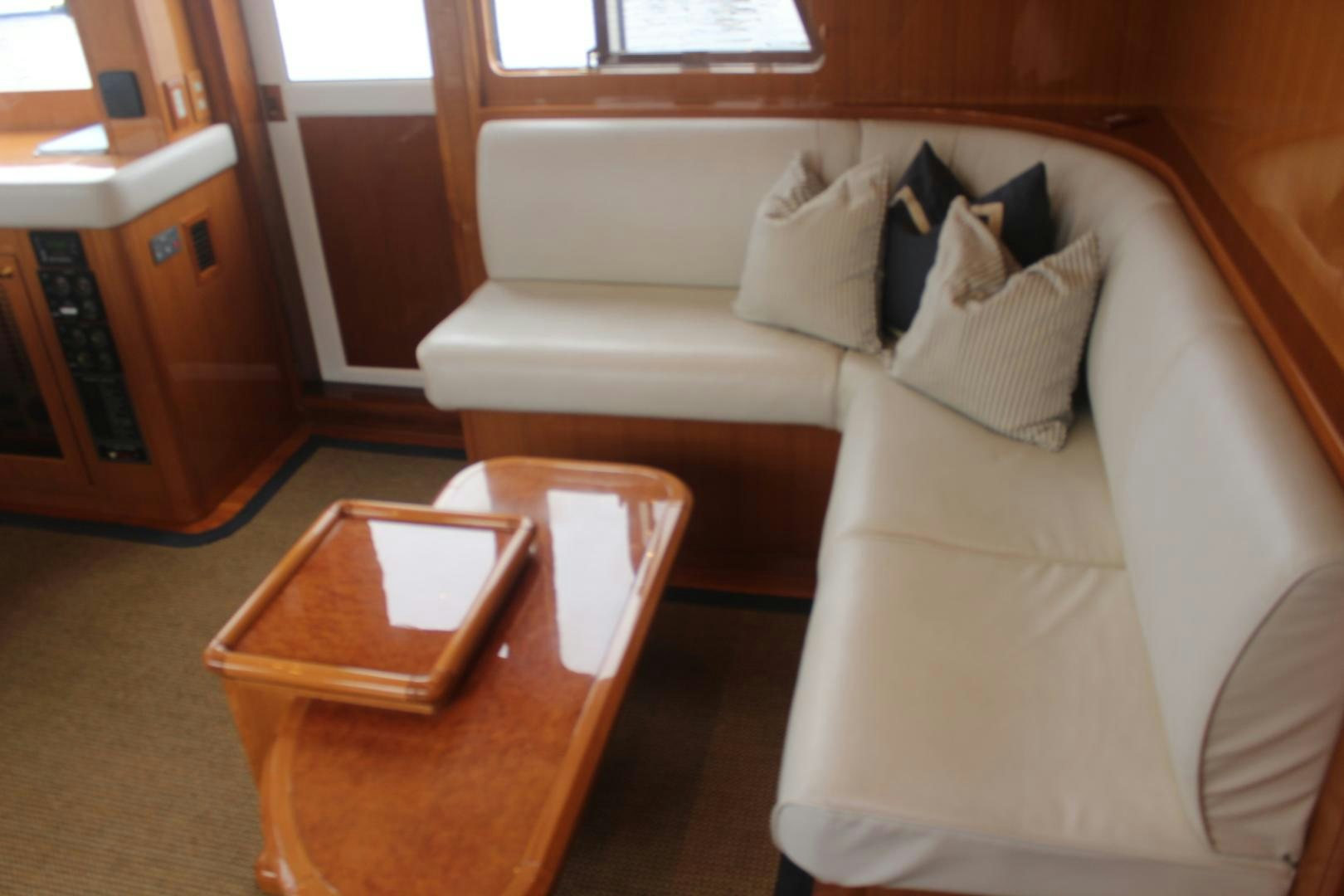 a couch and a coffee table aboard LADY CYNTHIA Yacht for Sale