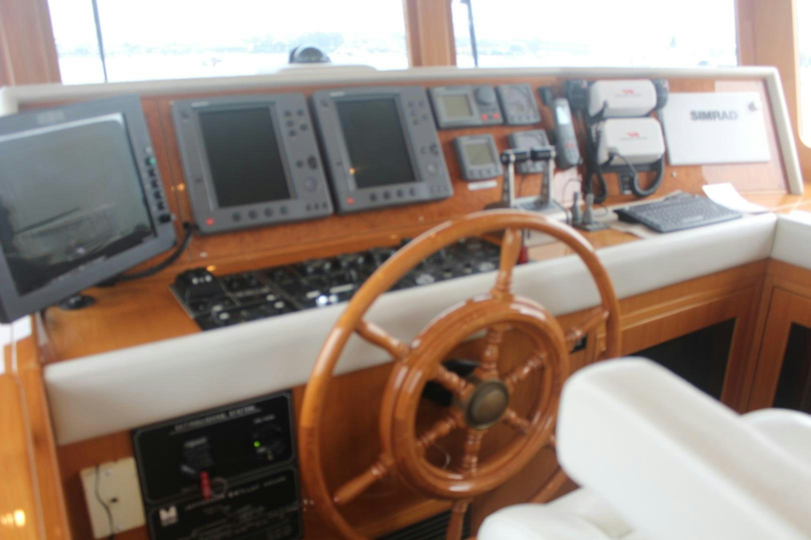 a desk with a computer and a chair aboard LADY CYNTHIA Yacht for Sale