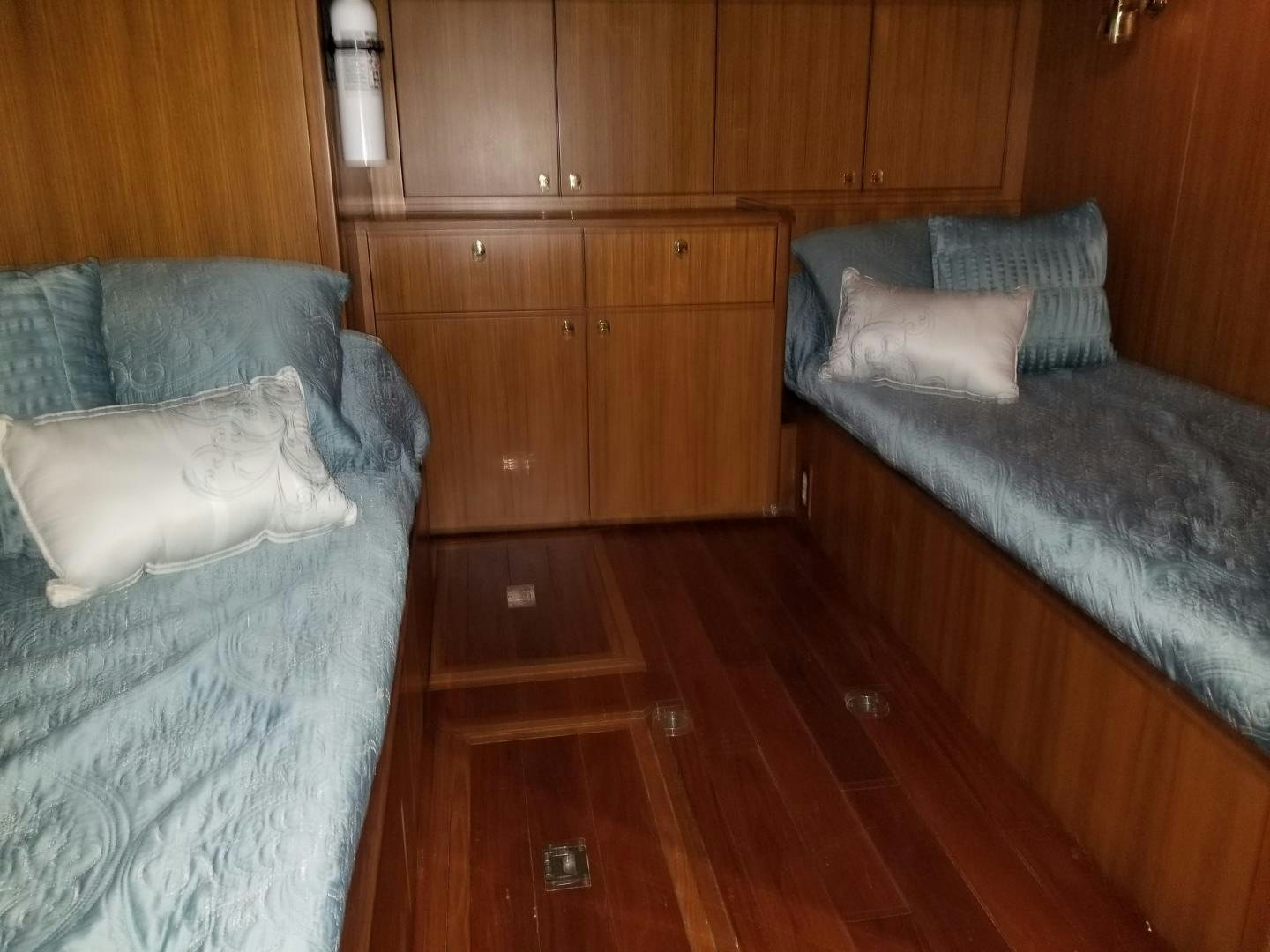 a room with wooden cabinets aboard LADY CYNTHIA Yacht for Sale
