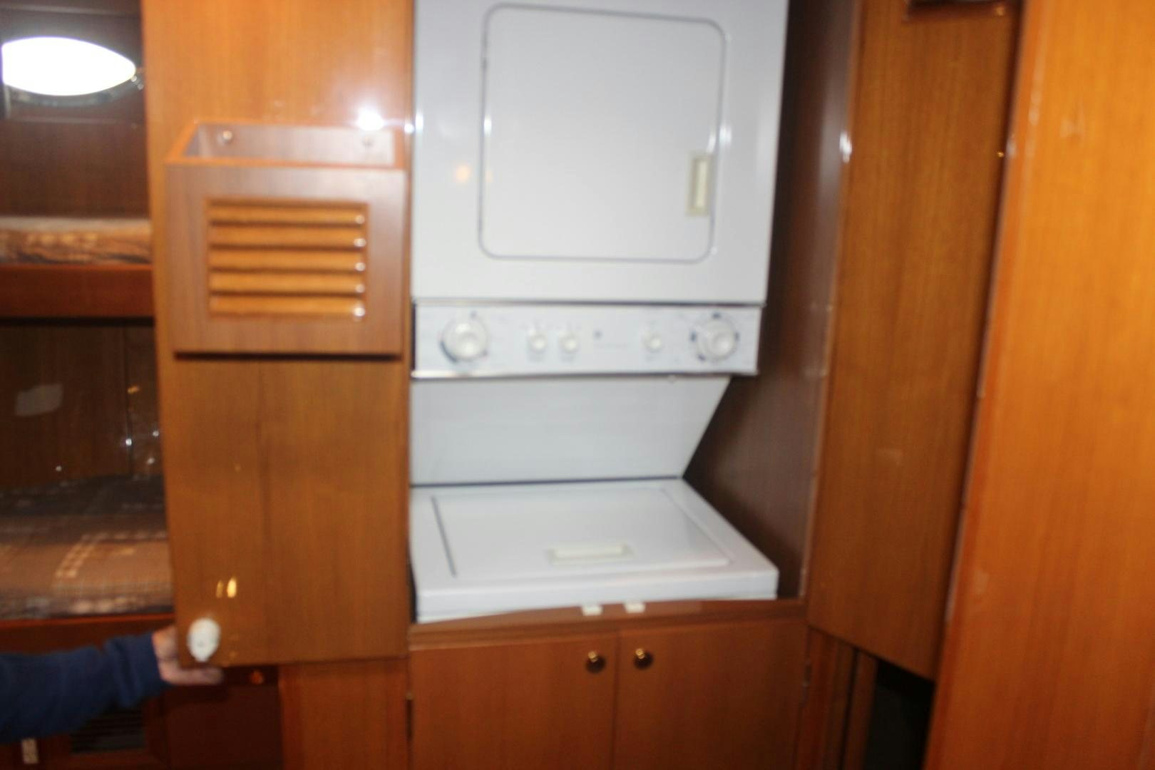 a white oven in a wooden cabinet aboard LADY CYNTHIA Yacht for Sale