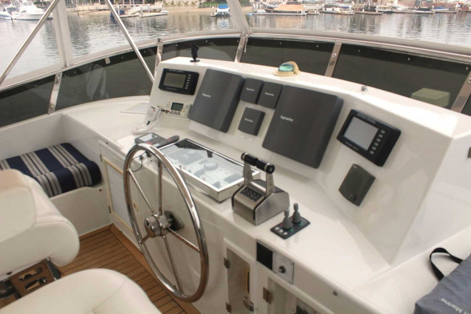 a white boat with black and silver panels aboard LADY CYNTHIA Yacht for Sale