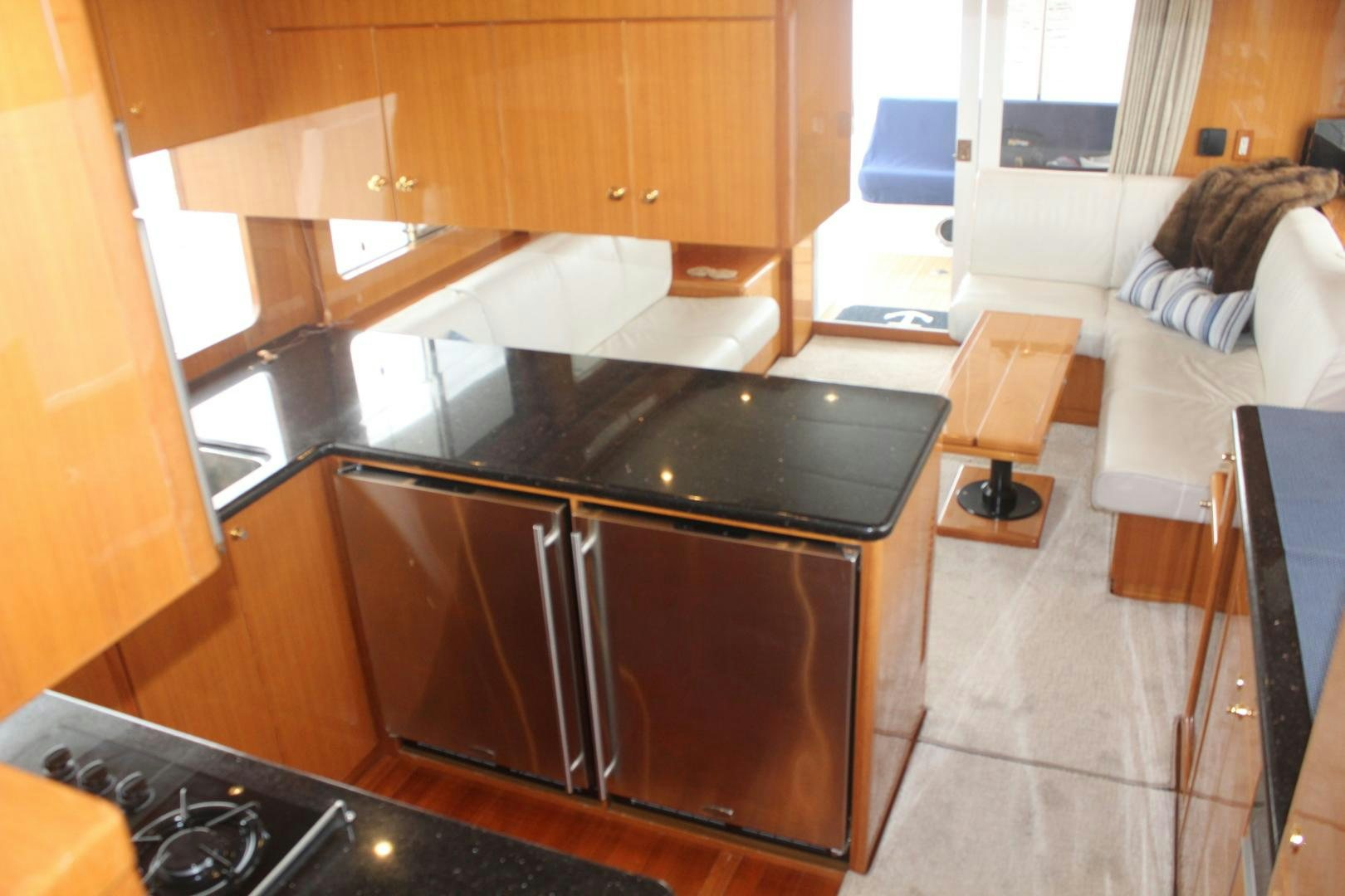 a kitchen with a black counter aboard LADY CYNTHIA Yacht for Sale