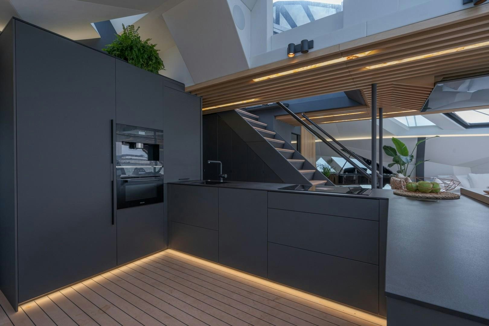 a kitchen with a large refrigerator aboard X1 Yacht for Sale