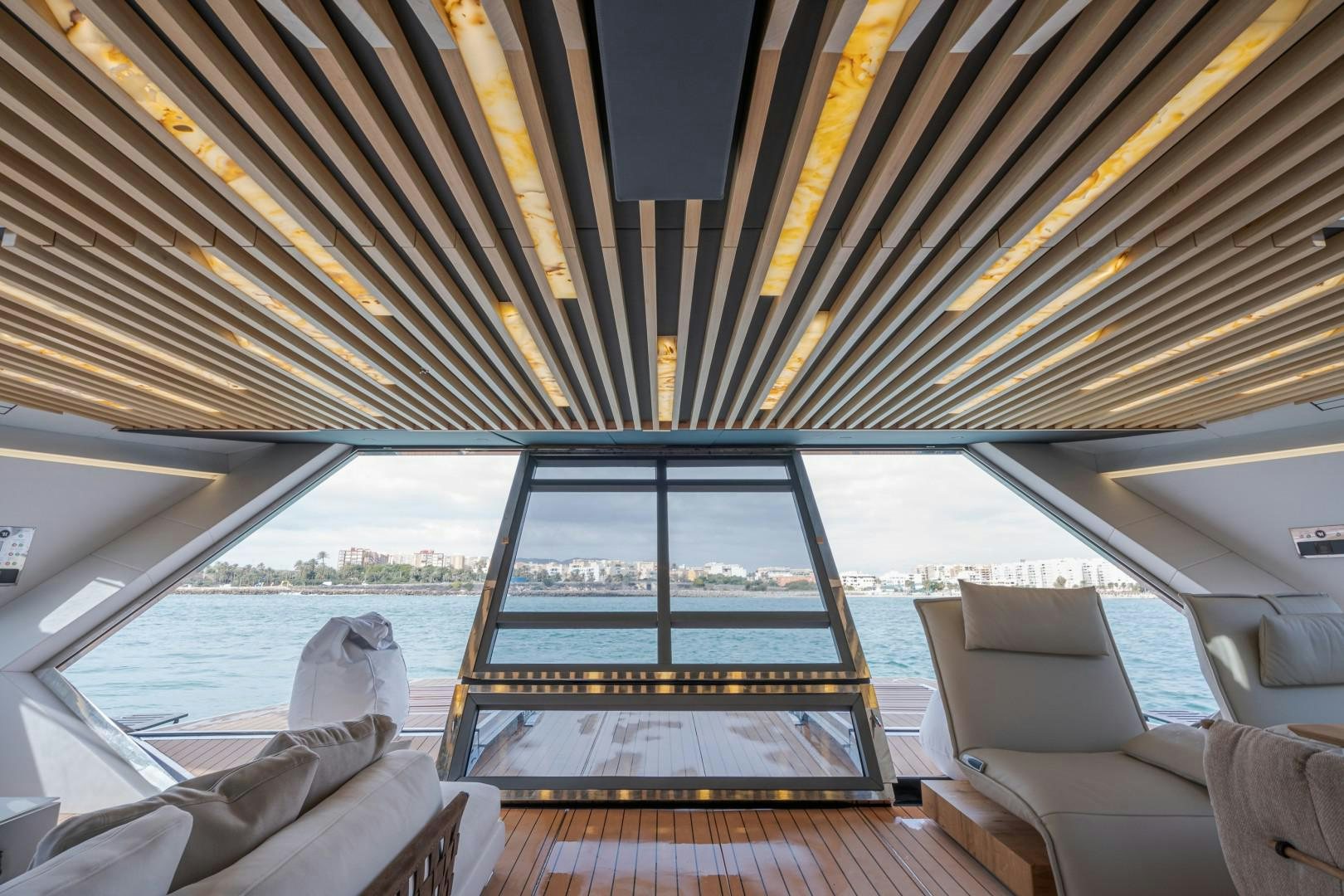 a boat with a large window aboard X1 Yacht for Sale