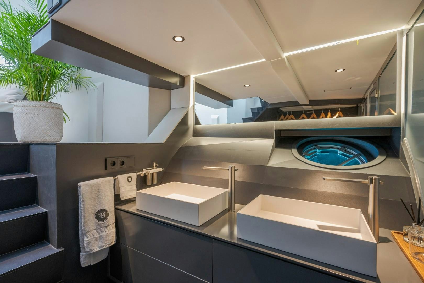a modern bathroom with a large jacuzzi tub aboard X1 Yacht for Sale