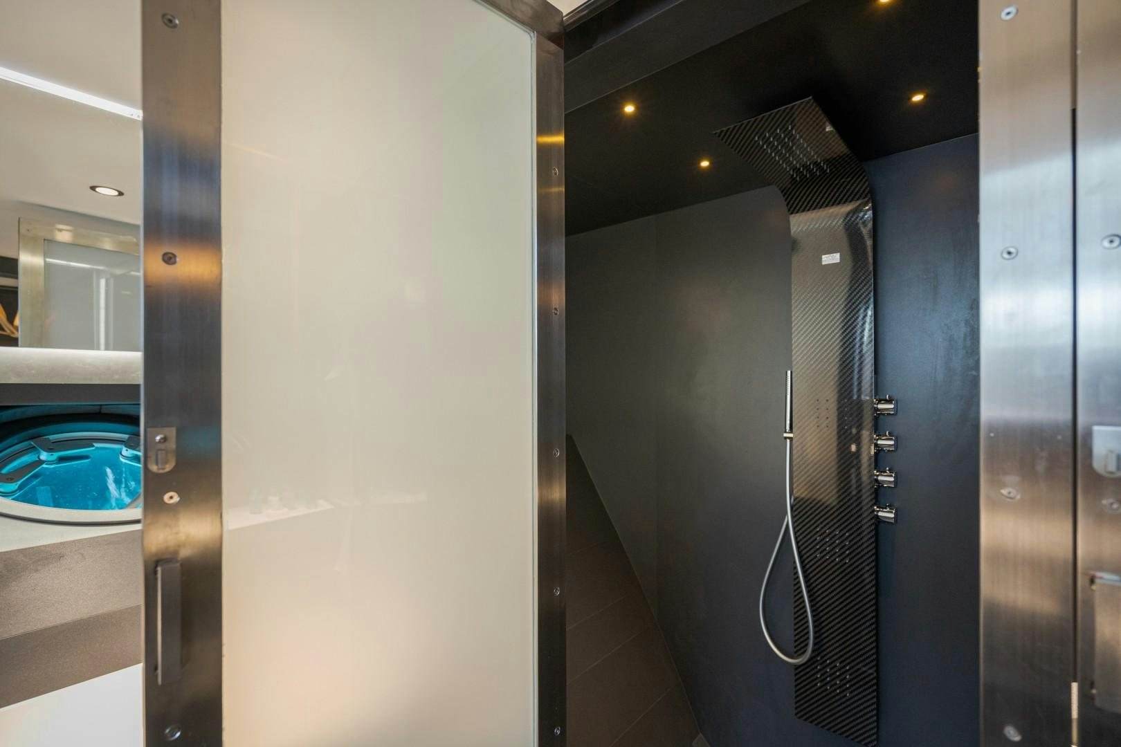 a hallway with glass doors aboard X1 Yacht for Sale