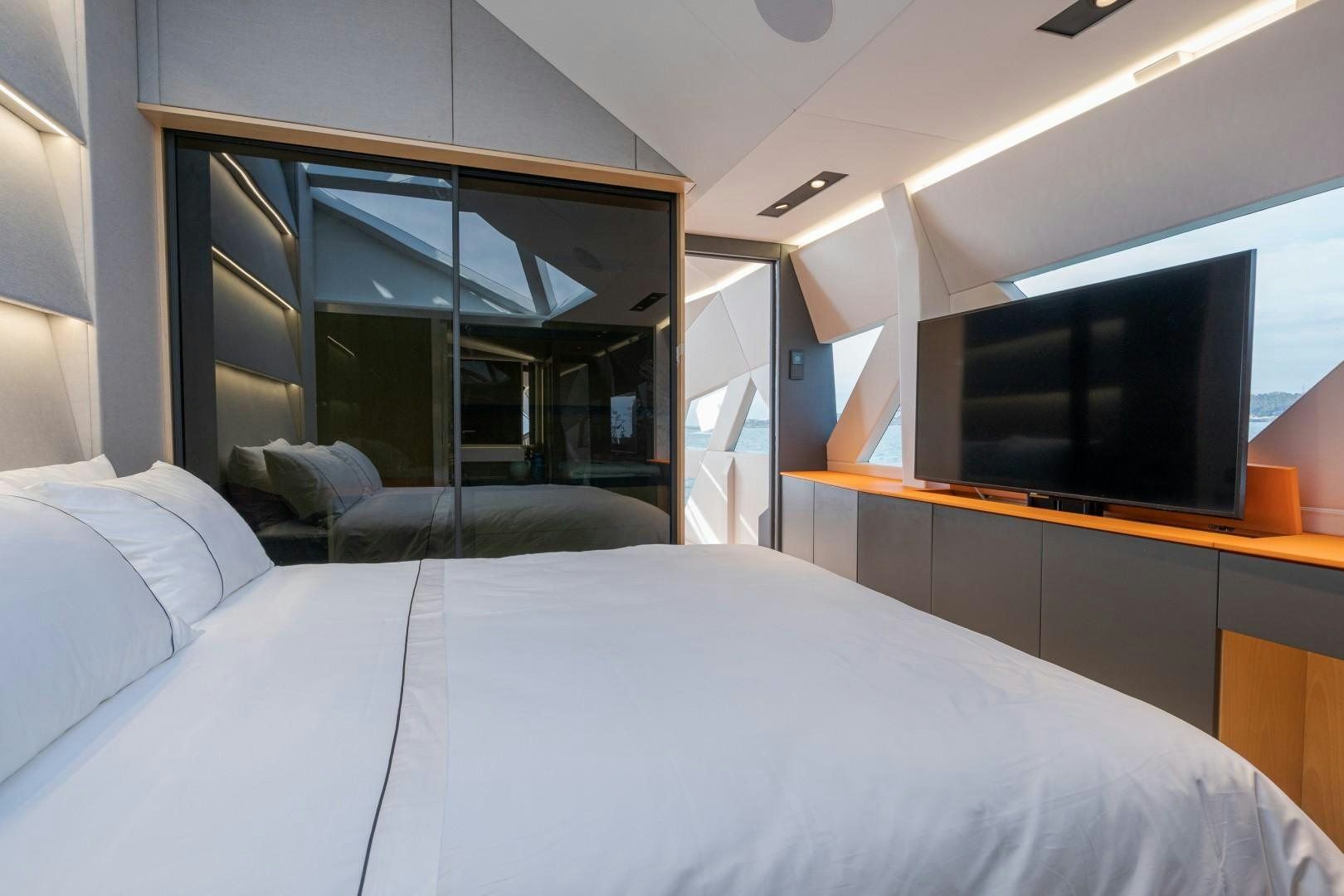 a room with a bed and a tv aboard X1 Yacht for Sale