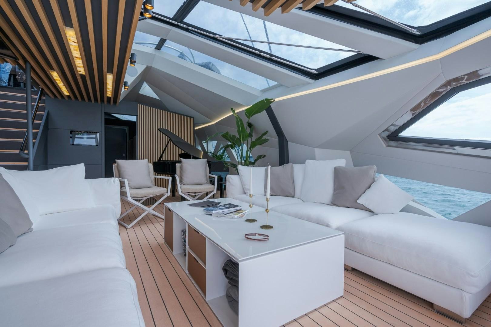 a room with a table and chairs aboard X1 Yacht for Sale