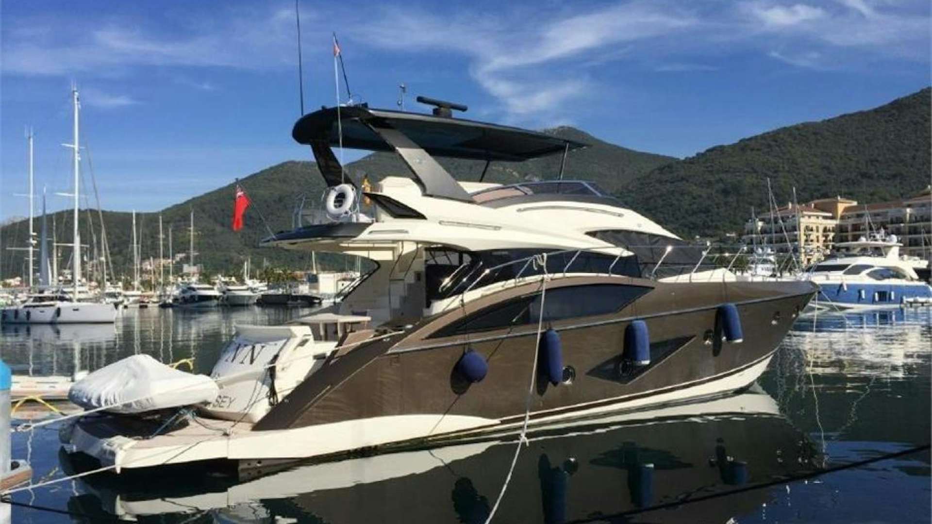 a boat docked at a pier aboard FNN Yacht for Sale