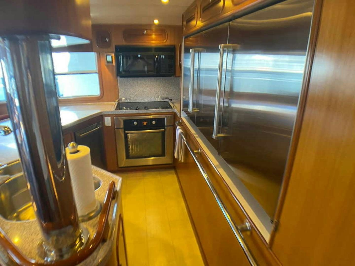 a kitchen with a large glass door aboard RHINO 1 Yacht for Sale