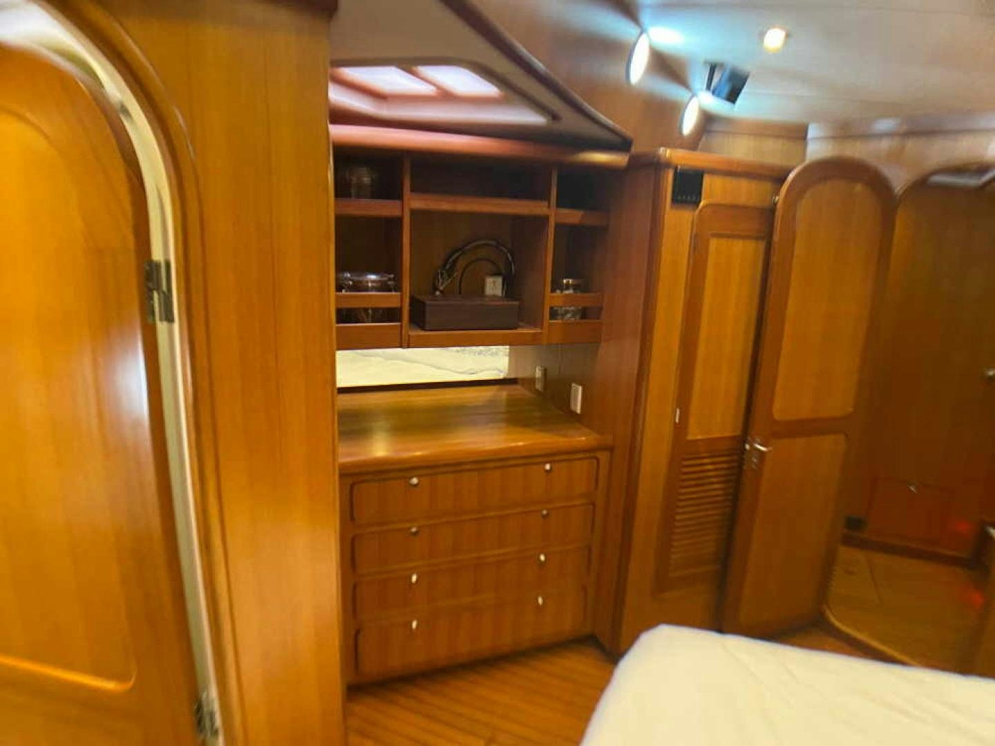a room with a wood cabinet and a mirror aboard RHINO 1 Yacht for Sale