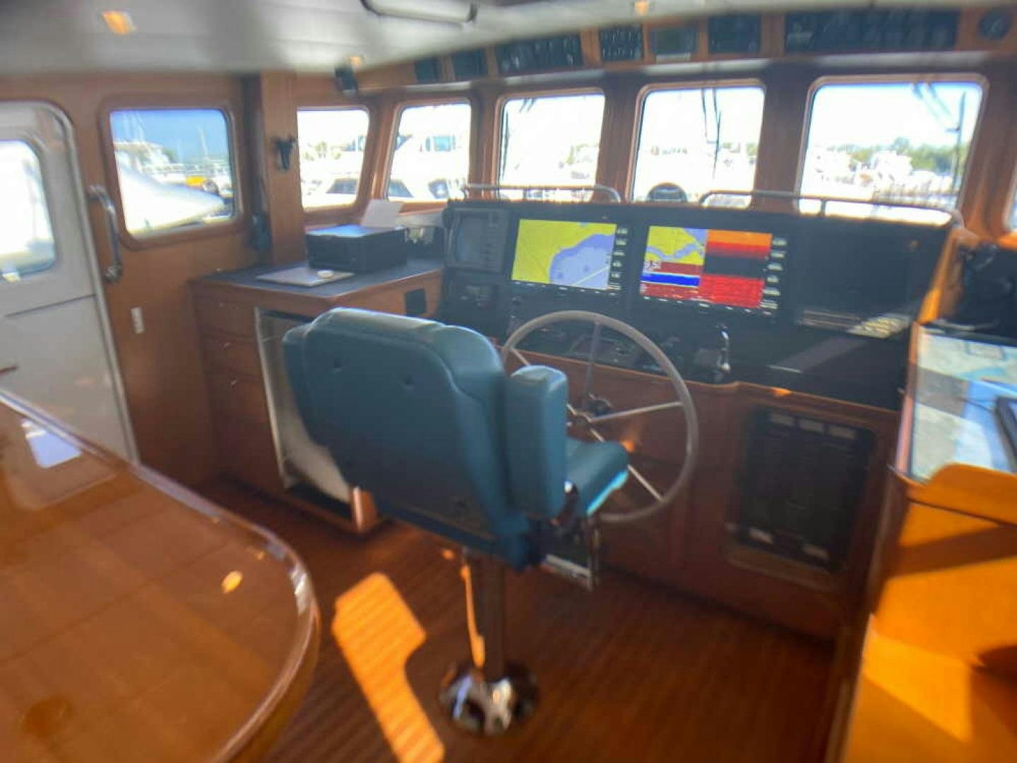 a black office chair in a room with many monitors and a computer aboard RHINO 1 Yacht for Sale