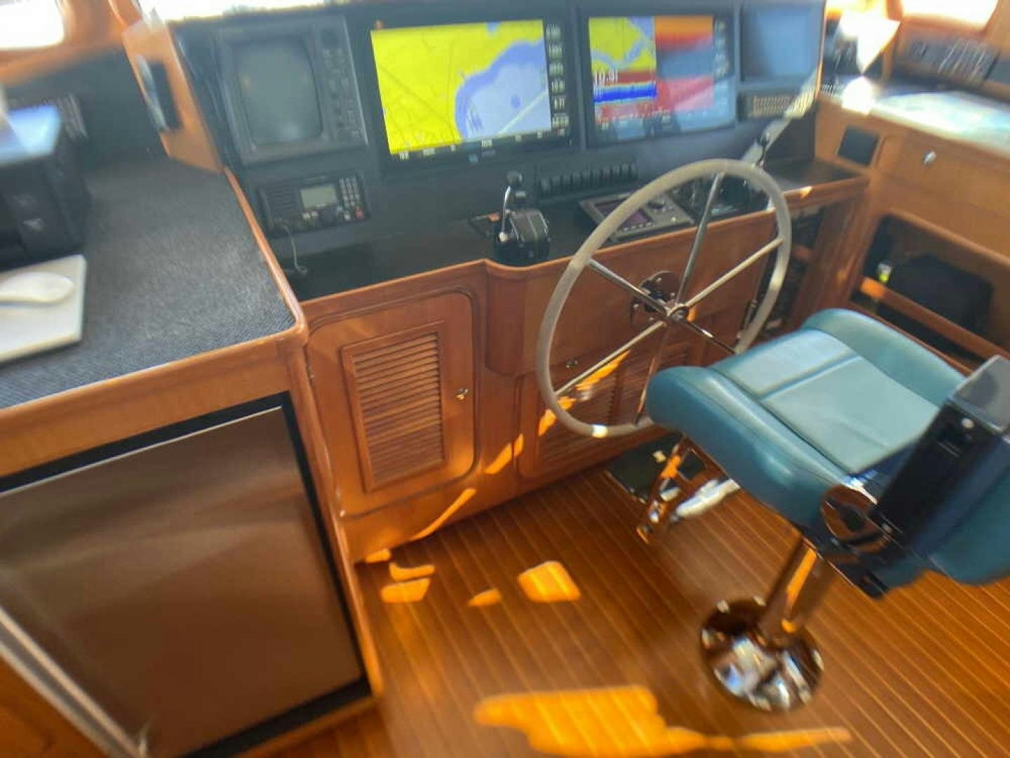 a wooden chair in a room aboard RHINO 1 Yacht for Sale