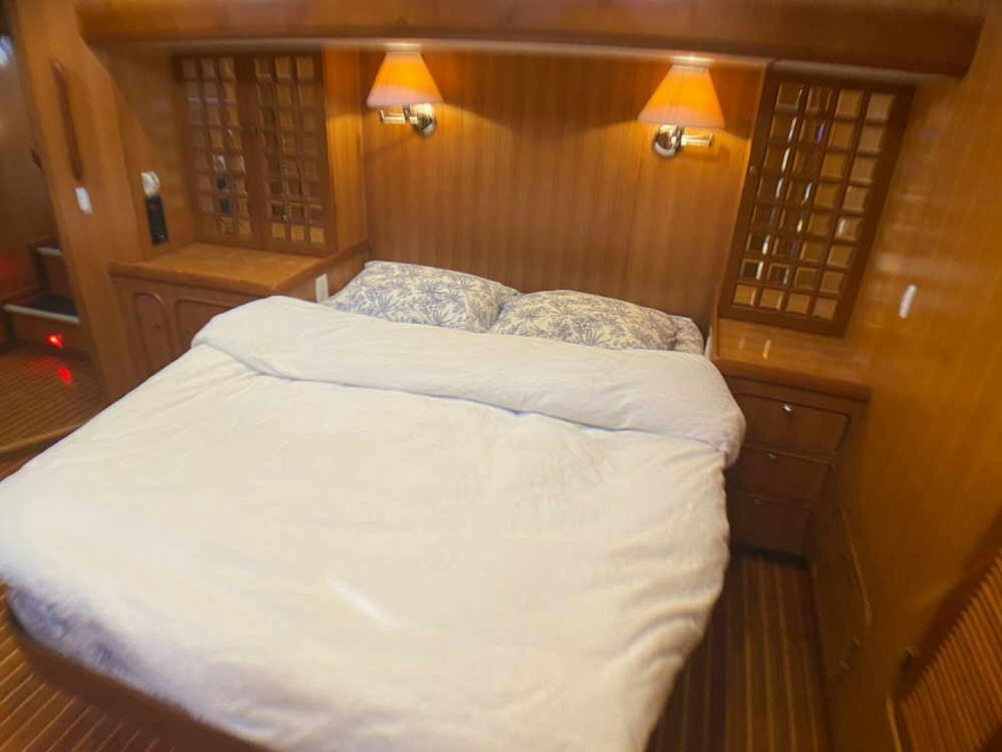 a bed with a white sheet aboard RHINO 1 Yacht for Sale