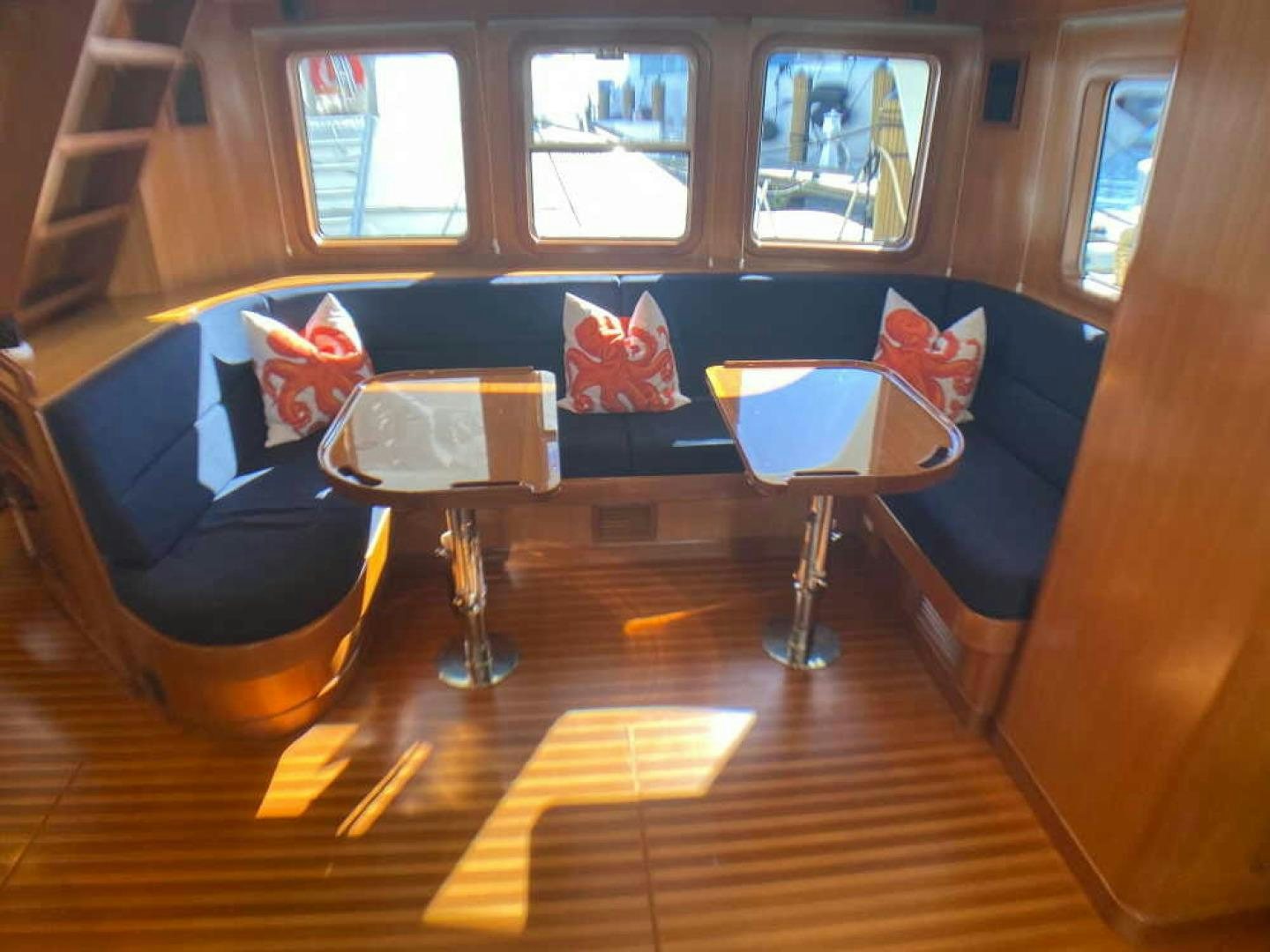 a room with a couch and chairs aboard RHINO 1 Yacht for Sale