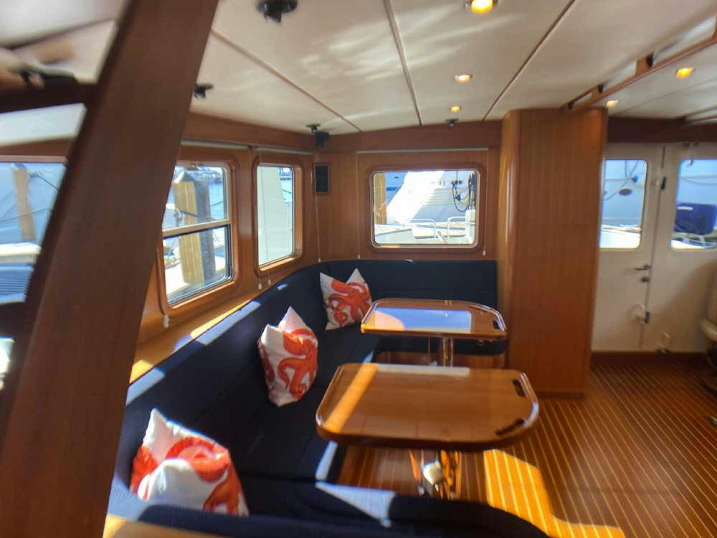 a room with a couch and a table aboard RHINO 1 Yacht for Sale