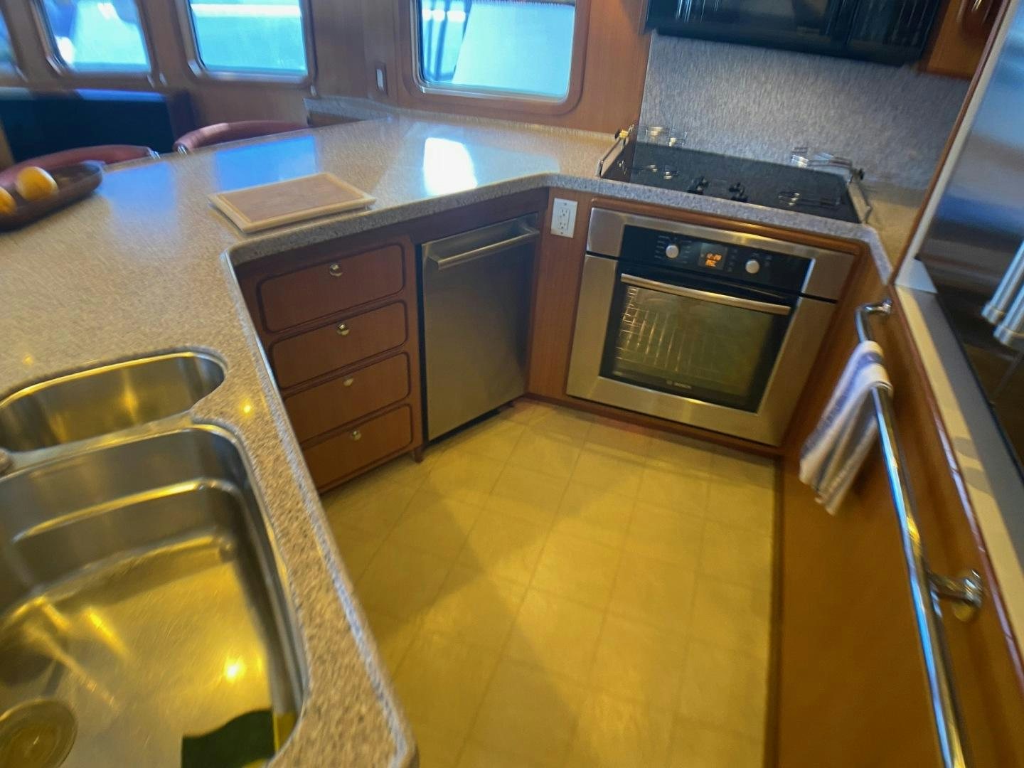 a kitchen with stainless steel appliances aboard RHINO 1 Yacht for Sale