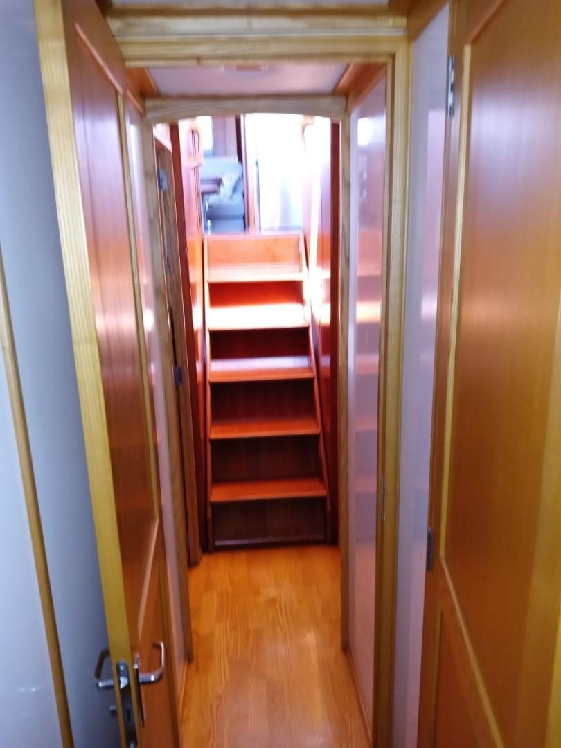 a room with a wood door aboard DESTINATION Yacht for Sale