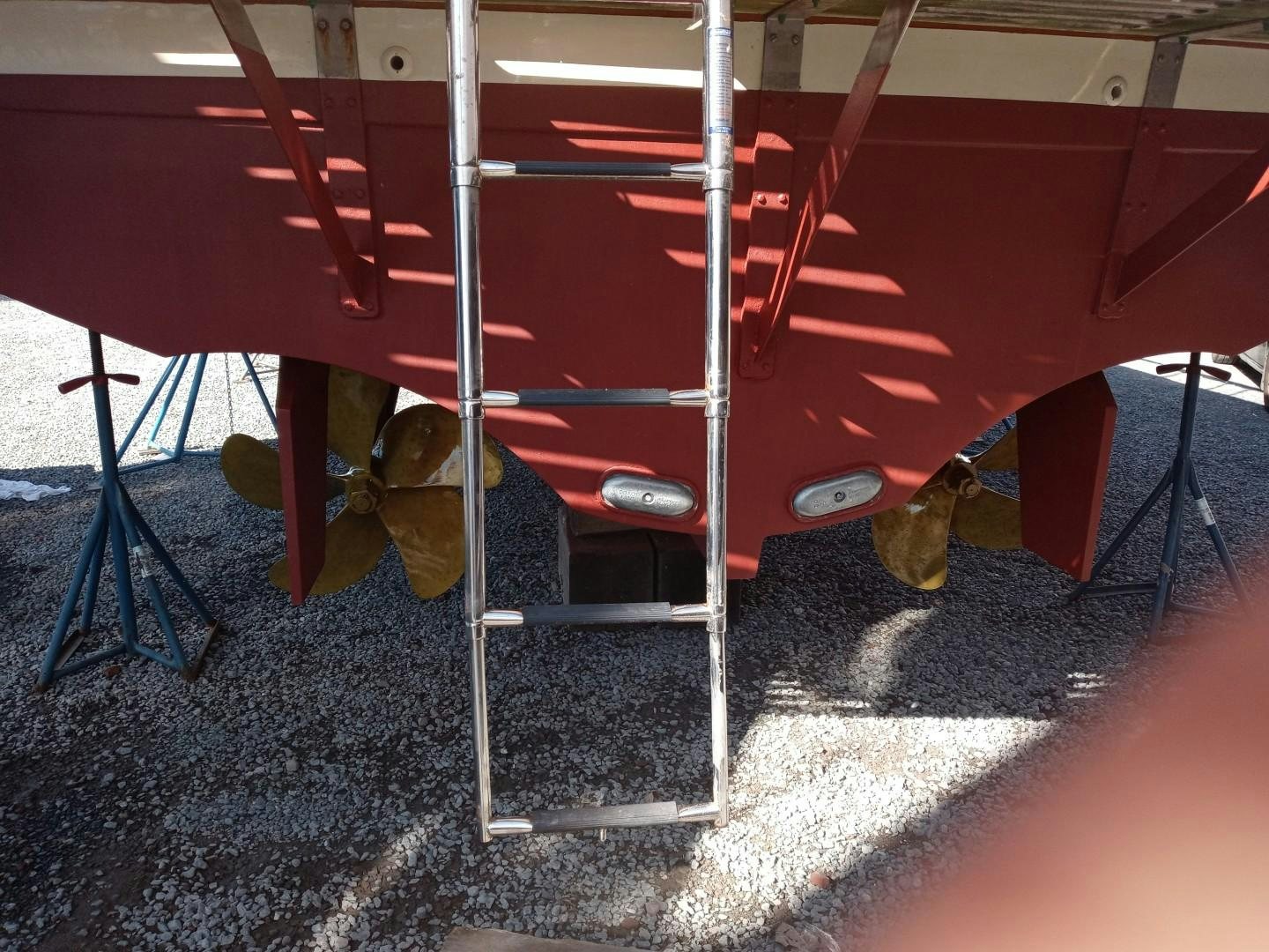 a red bench in a room aboard DESTINATION Yacht for Sale