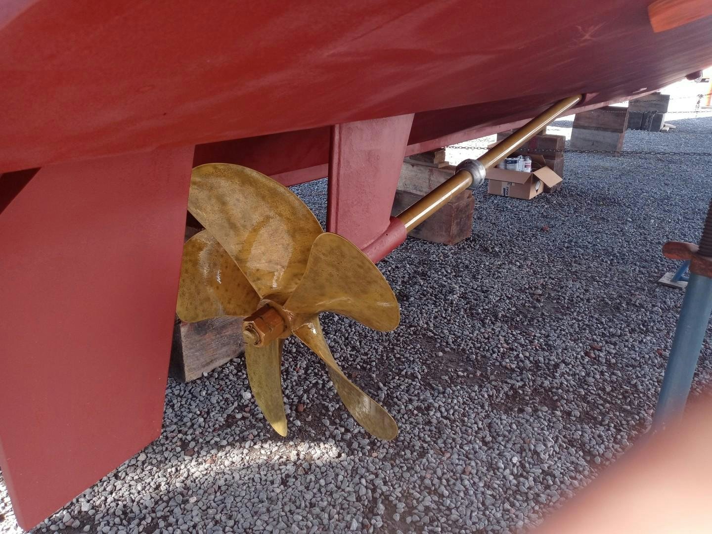 a toy dinosaur under a red couch aboard DESTINATION Yacht for Sale