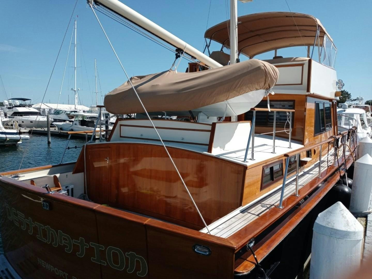 a boat docked at a pier aboard DESTINATION Yacht for Sale