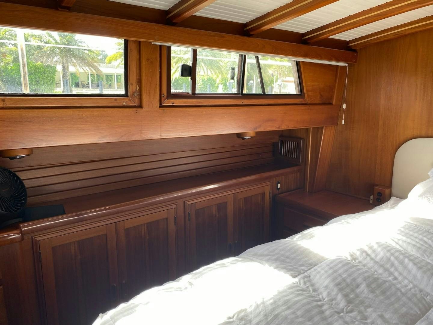 a room with wooden walls aboard DESTINATION Yacht for Sale
