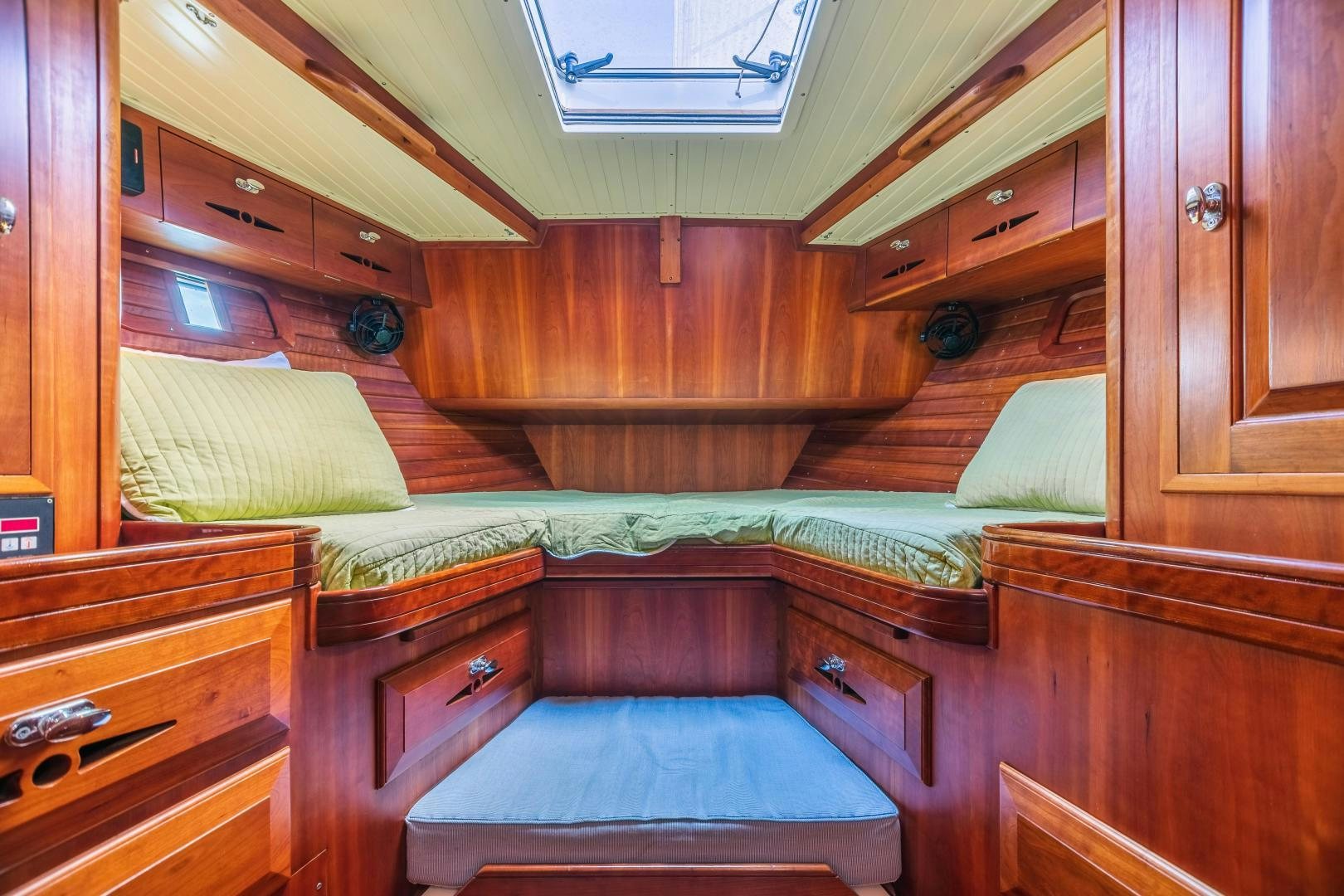 a room with wooden furniture aboard SHOWTIME Yacht for Sale