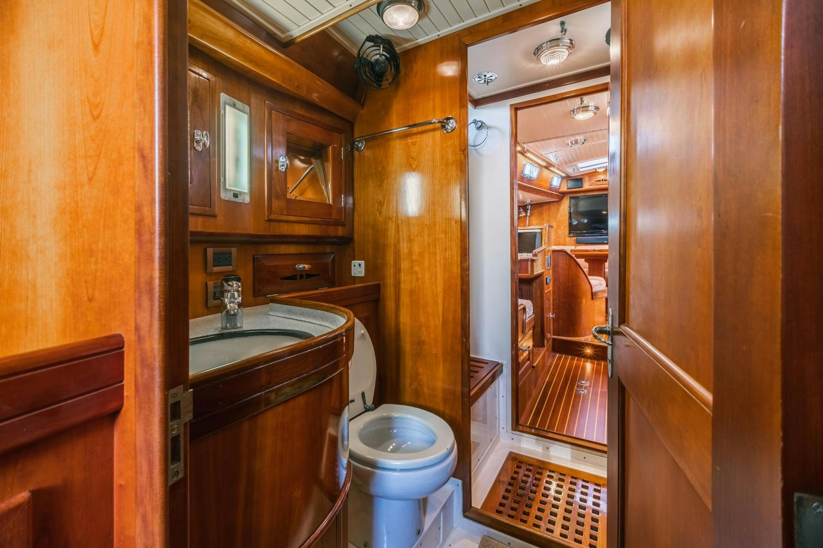 a bathroom with a toilet and sink aboard SHOWTIME Yacht for Sale