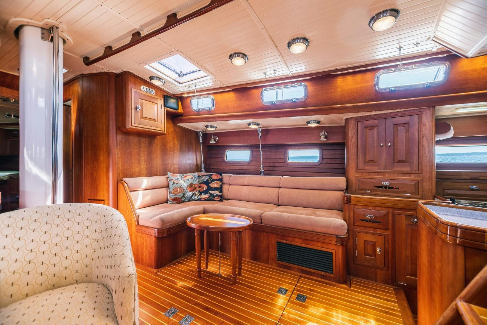 a living room with a couch and a table aboard SHOWTIME Yacht for Sale