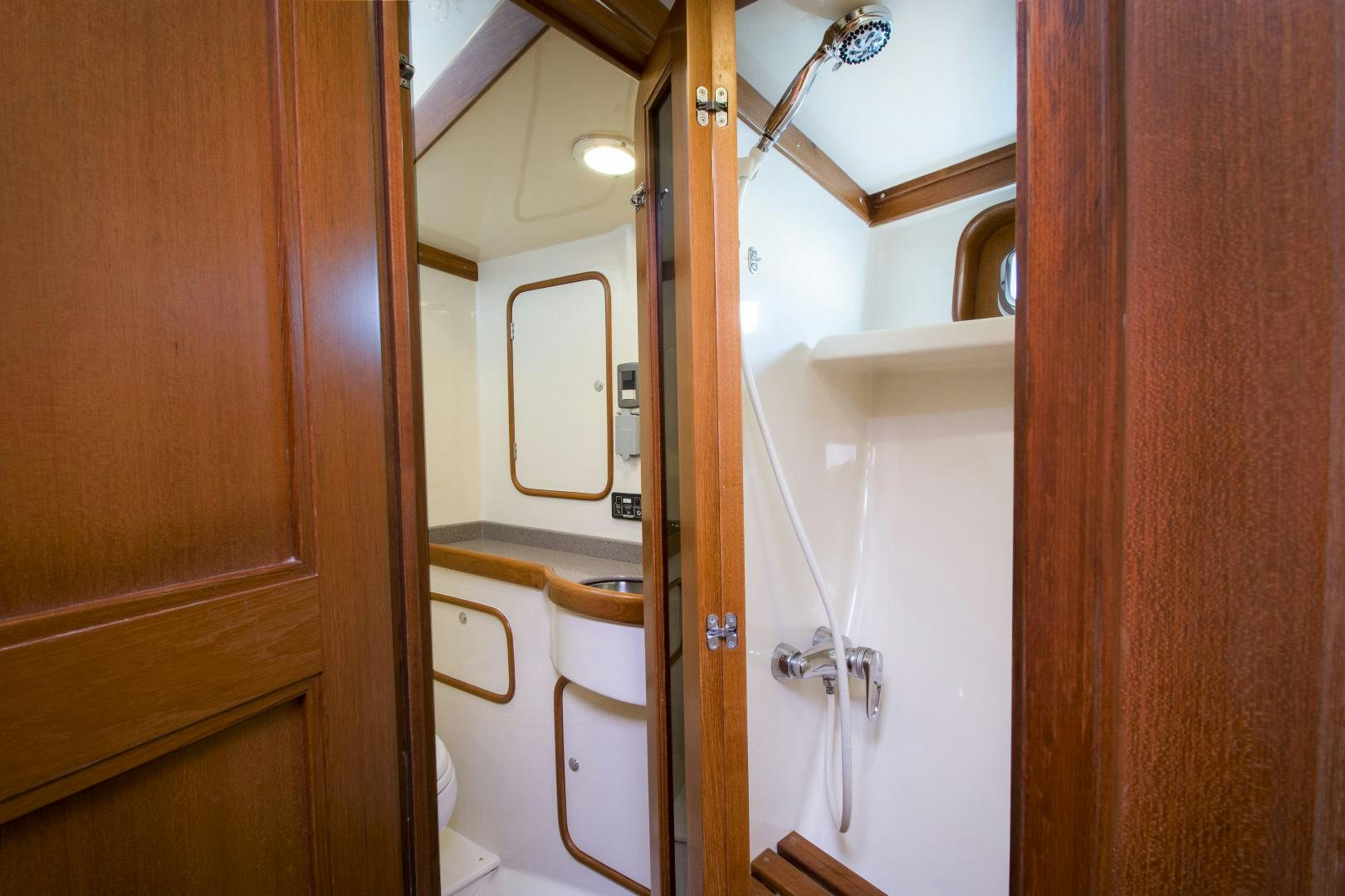 a bathroom with a toilet and a sink aboard REVERENCE Yacht for Sale