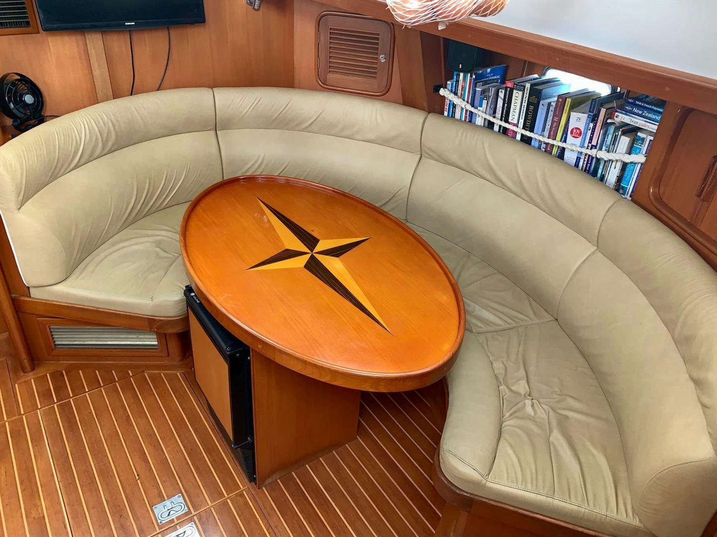 a clock on a coffee table aboard REVERENCE Yacht for Sale