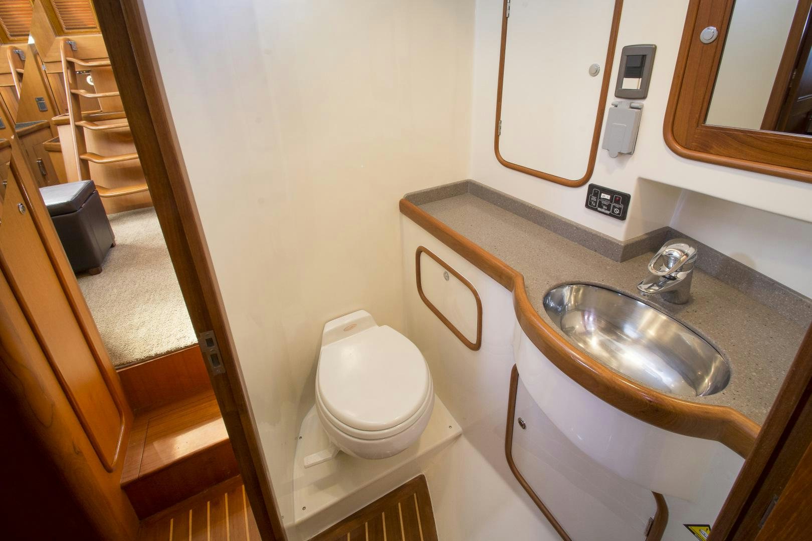 a bathroom with a sink and toilet aboard REVERENCE Yacht for Sale