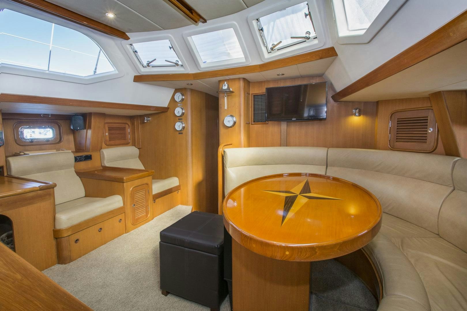 a room with a couch and a table aboard REVERENCE Yacht for Sale