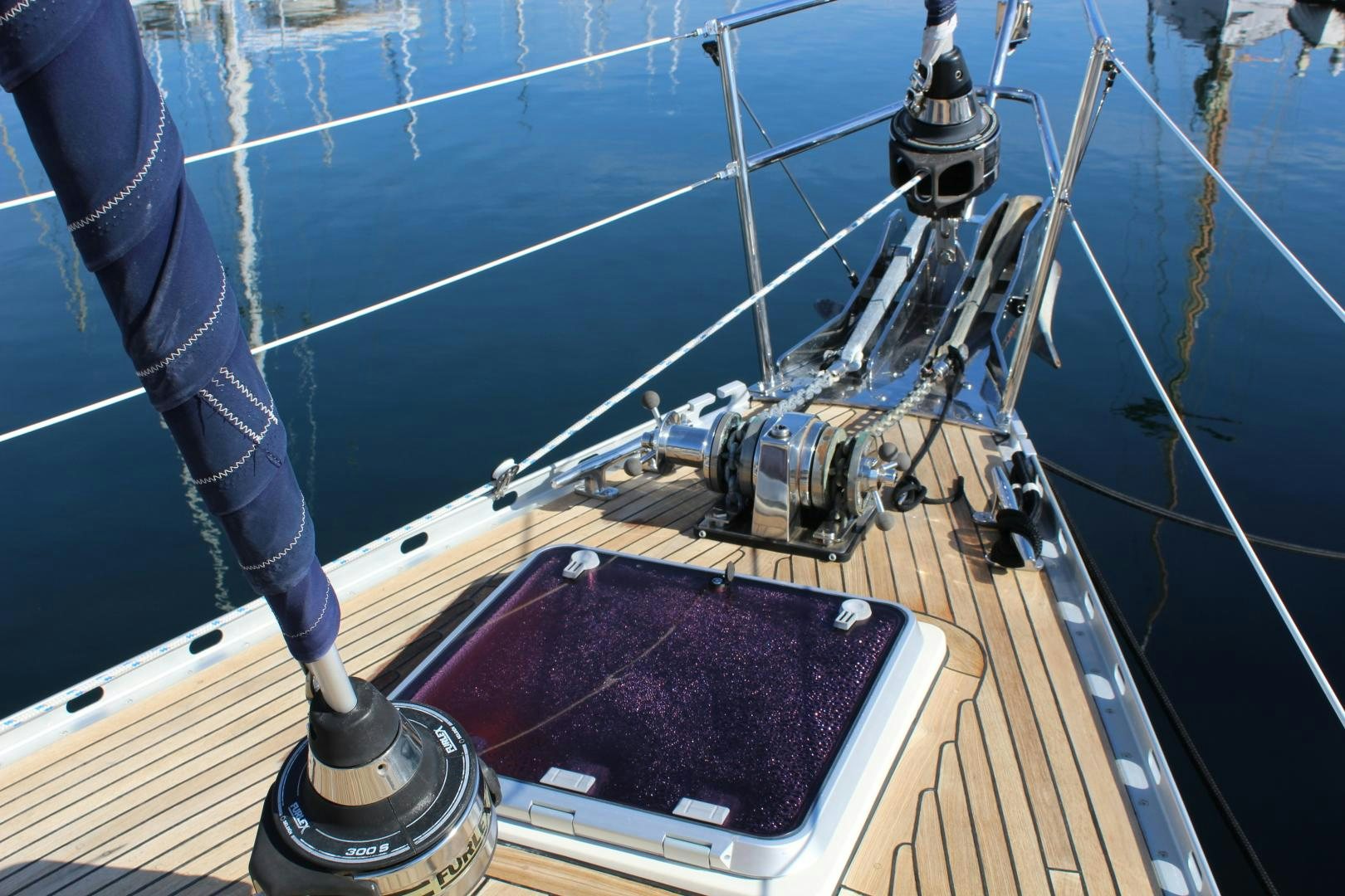 a sailboat with a red sail aboard REVERENCE Yacht for Sale