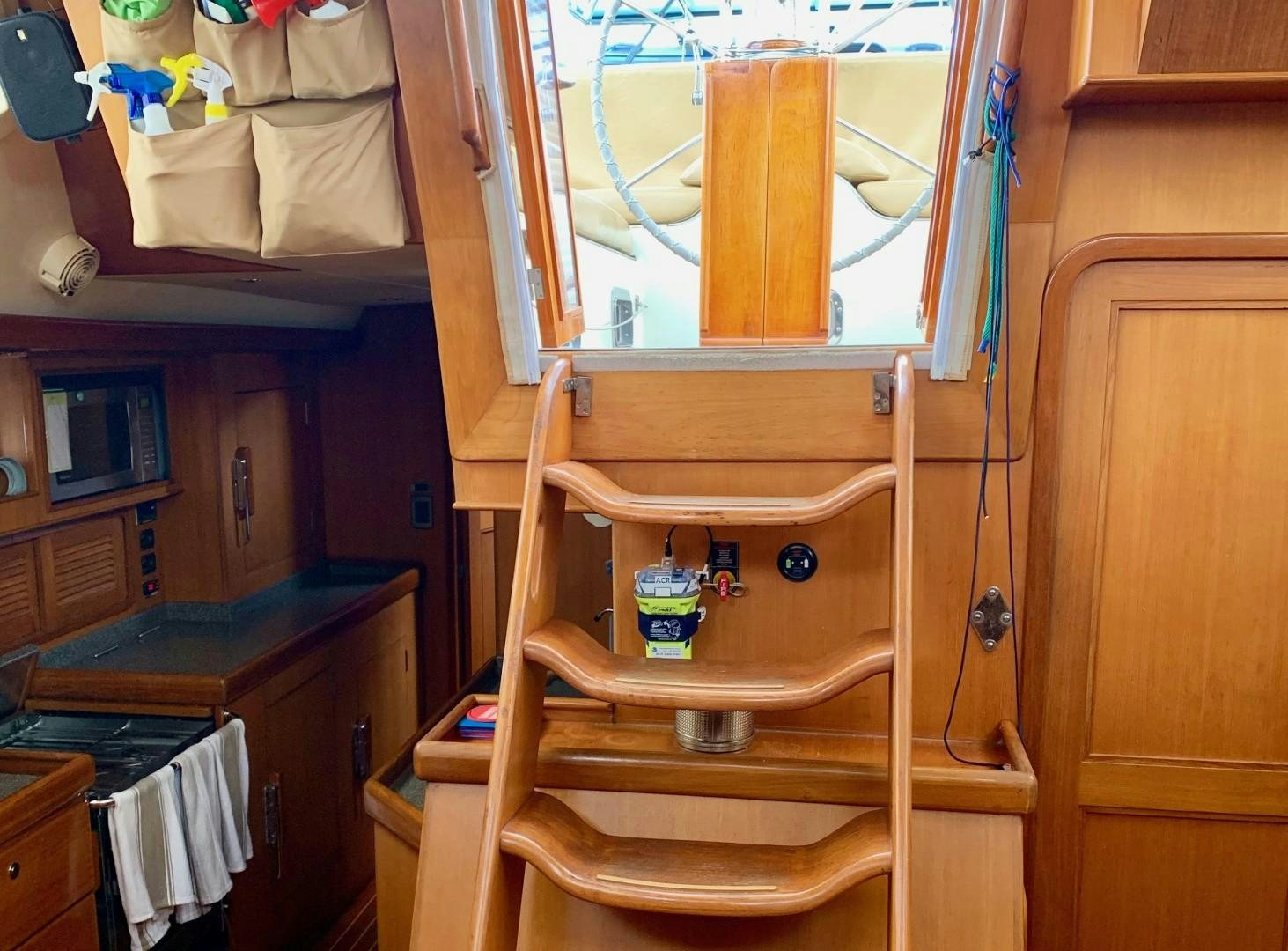 a wooden bunk bed in a room aboard REVERENCE Yacht for Sale