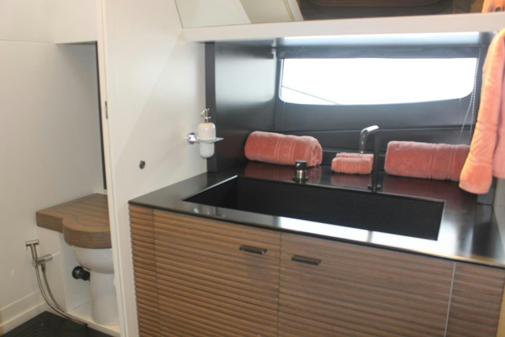 a bathroom with a large mirror aboard FELINA Yacht for Sale