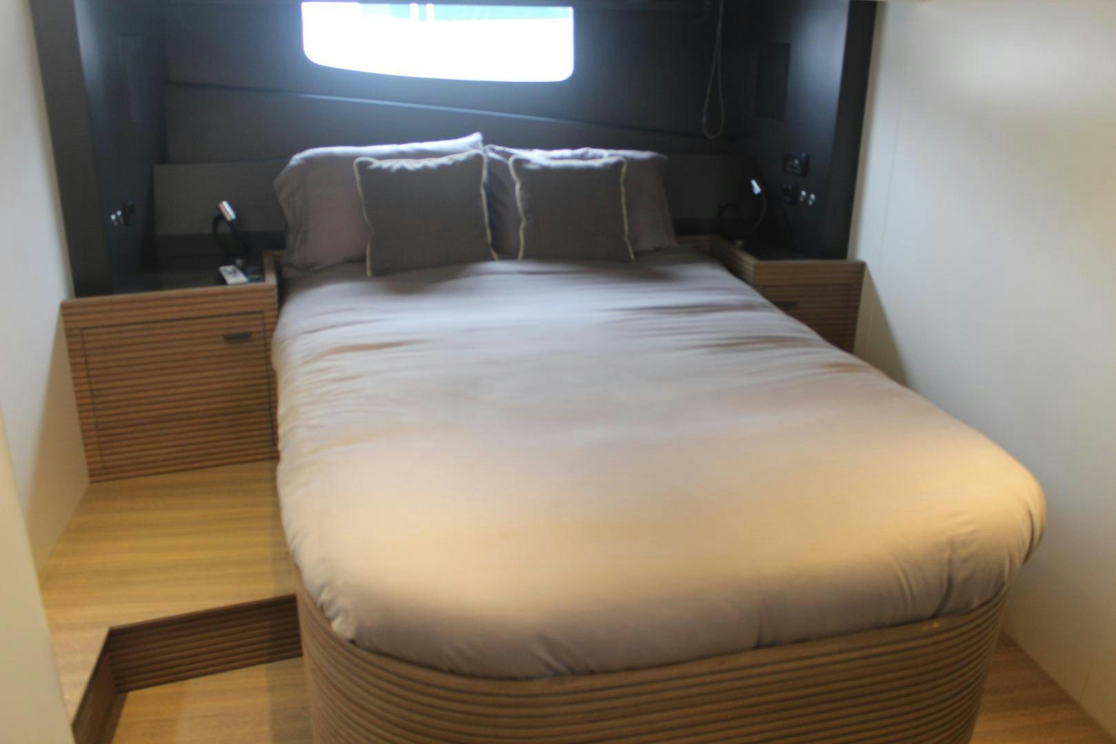 a bed with white sheets aboard FELINA Yacht for Sale