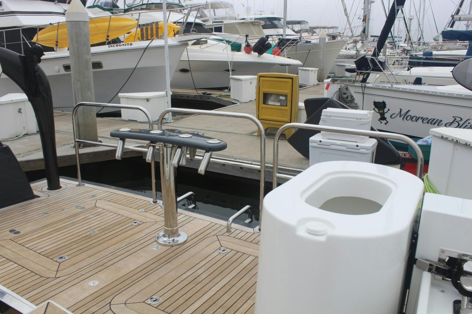 a boat dock with a table and chairs aboard FELINA Yacht for Sale
