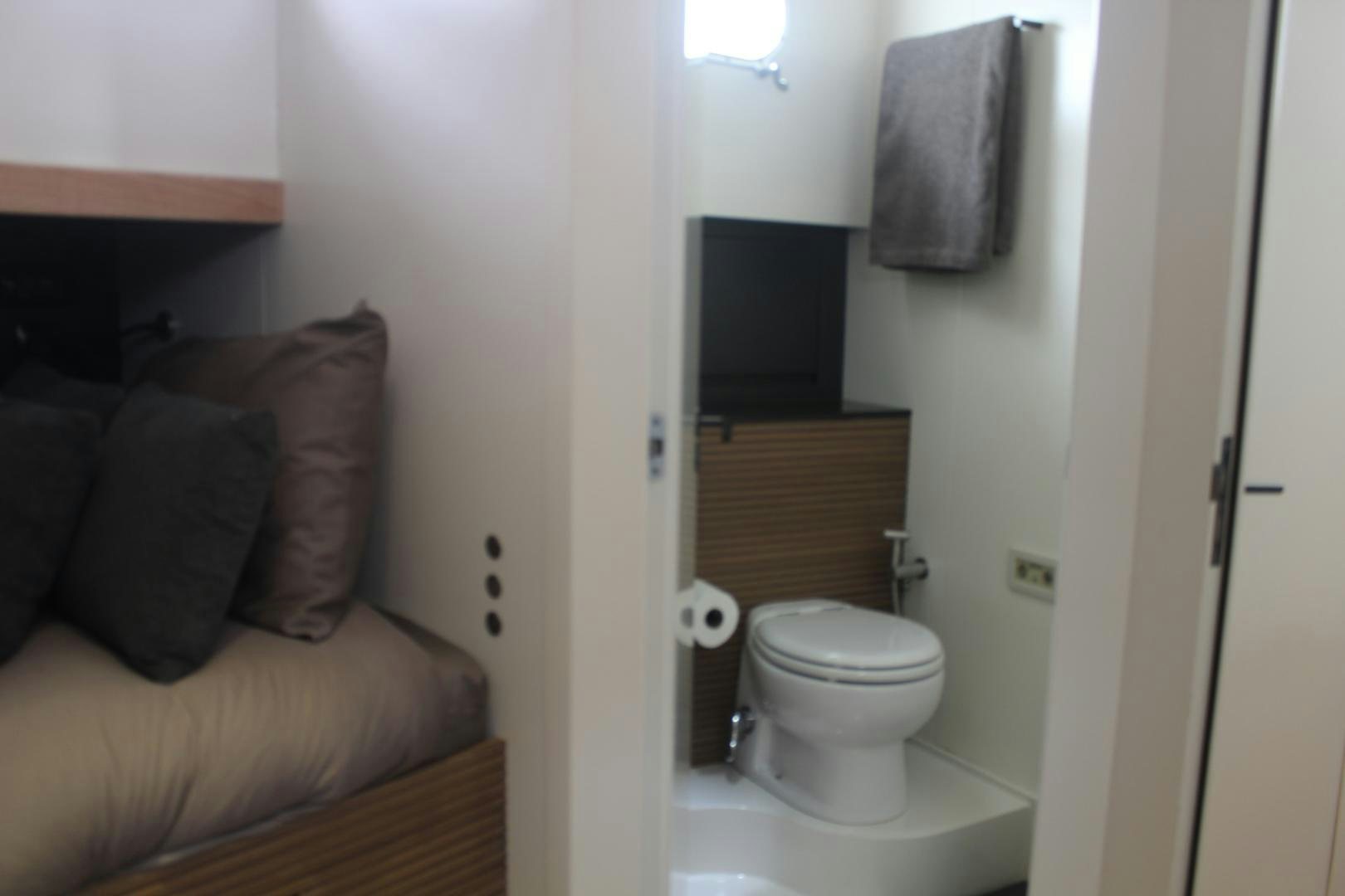 a small bathroom with a toilet aboard FELINA Yacht for Sale