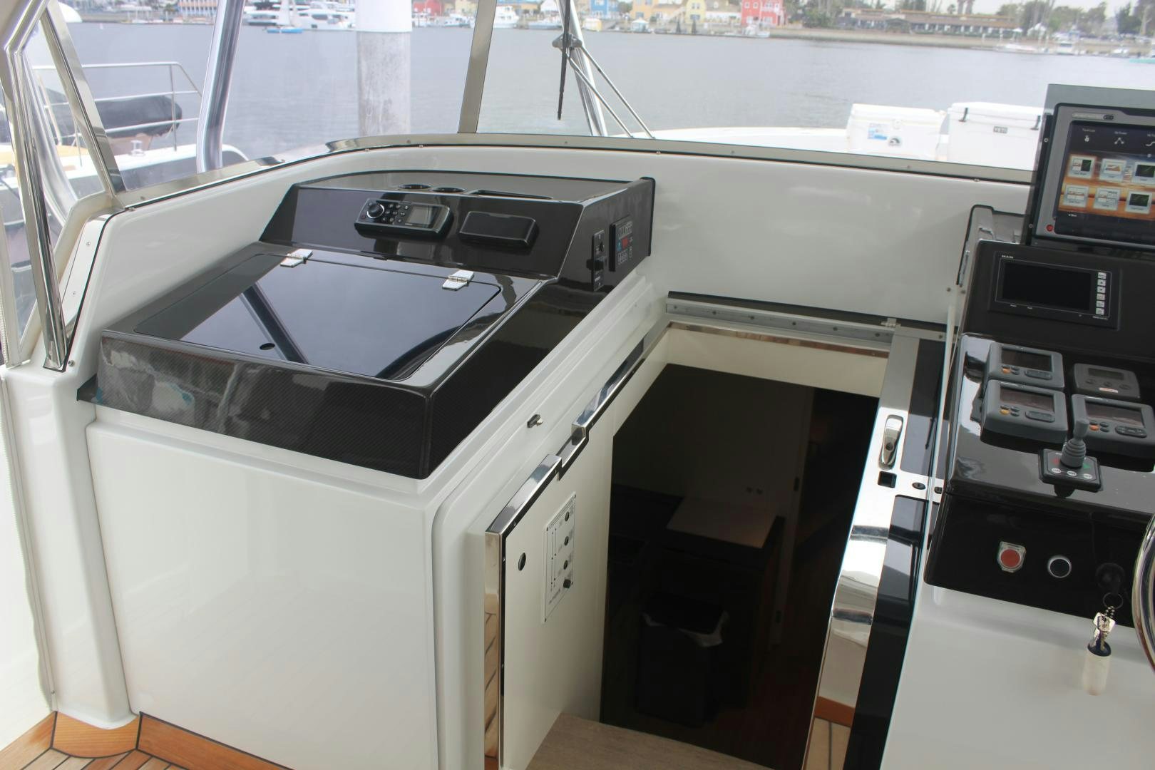 a white machine with black and silver buttons aboard FELINA Yacht for Sale